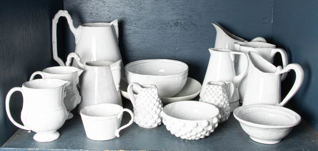 An assembled group of Astier De Villatte white glazed black pottery