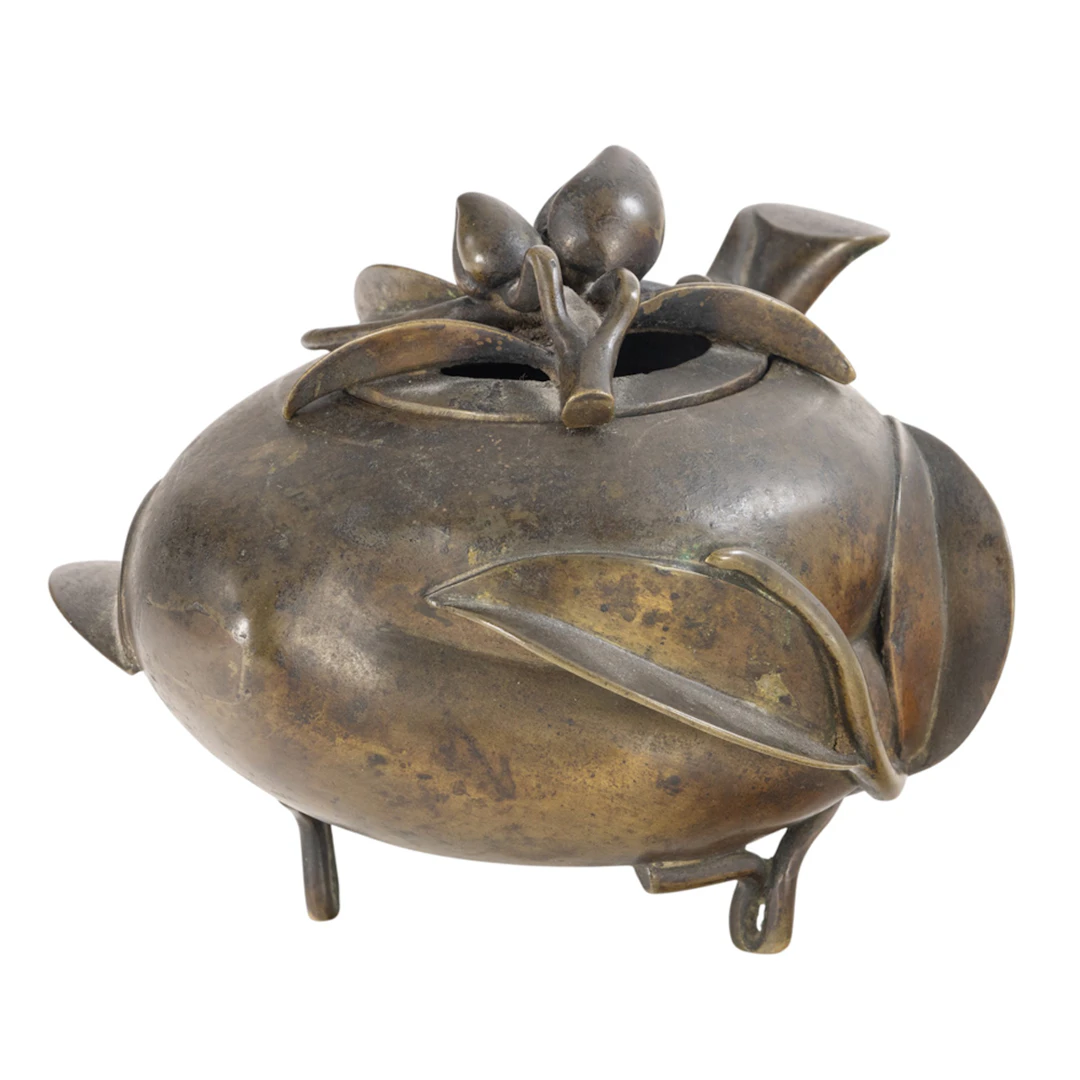 A Chinese cast bronze peach-form censer