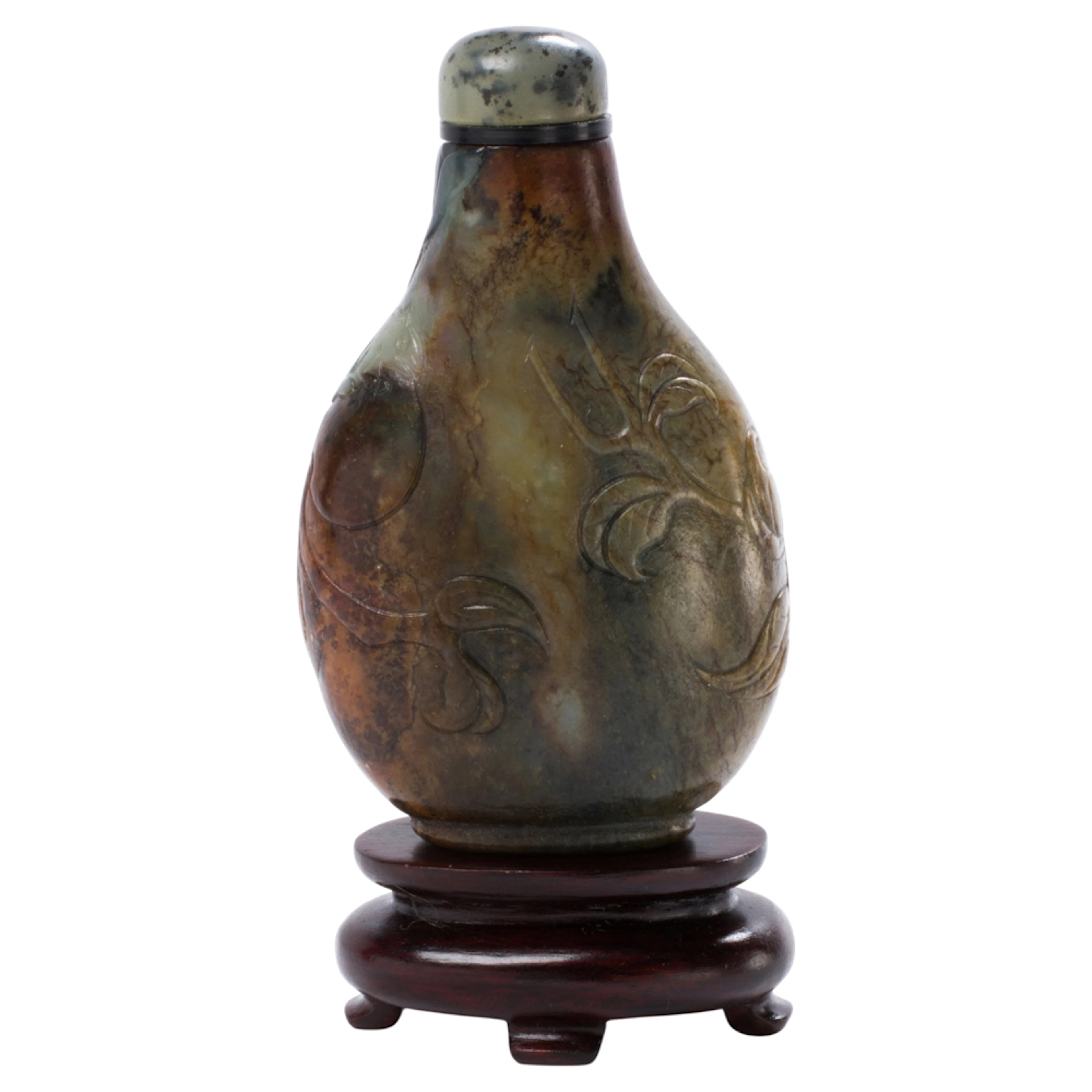 A Chinese black and celadon jade snuff bottle