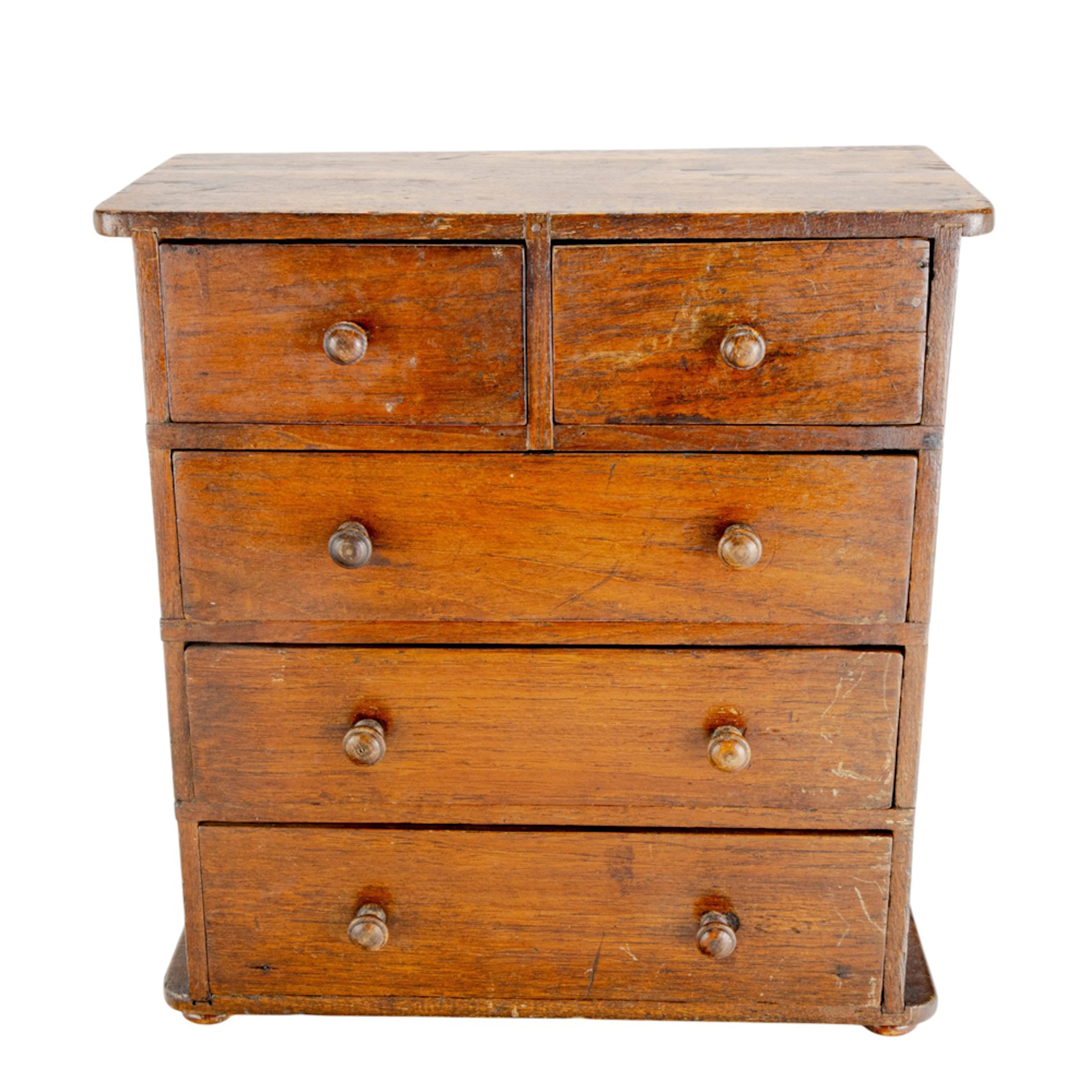 A miniature chest of drawers