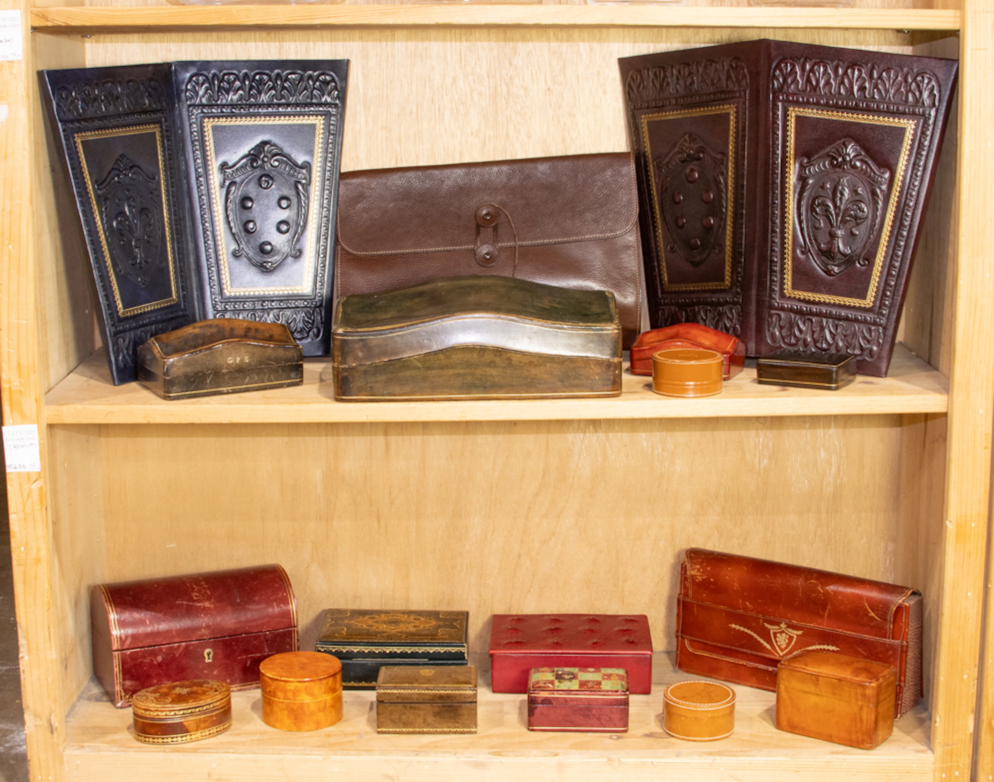 An assembled group of mostly vintage leather-bound trinket boxes