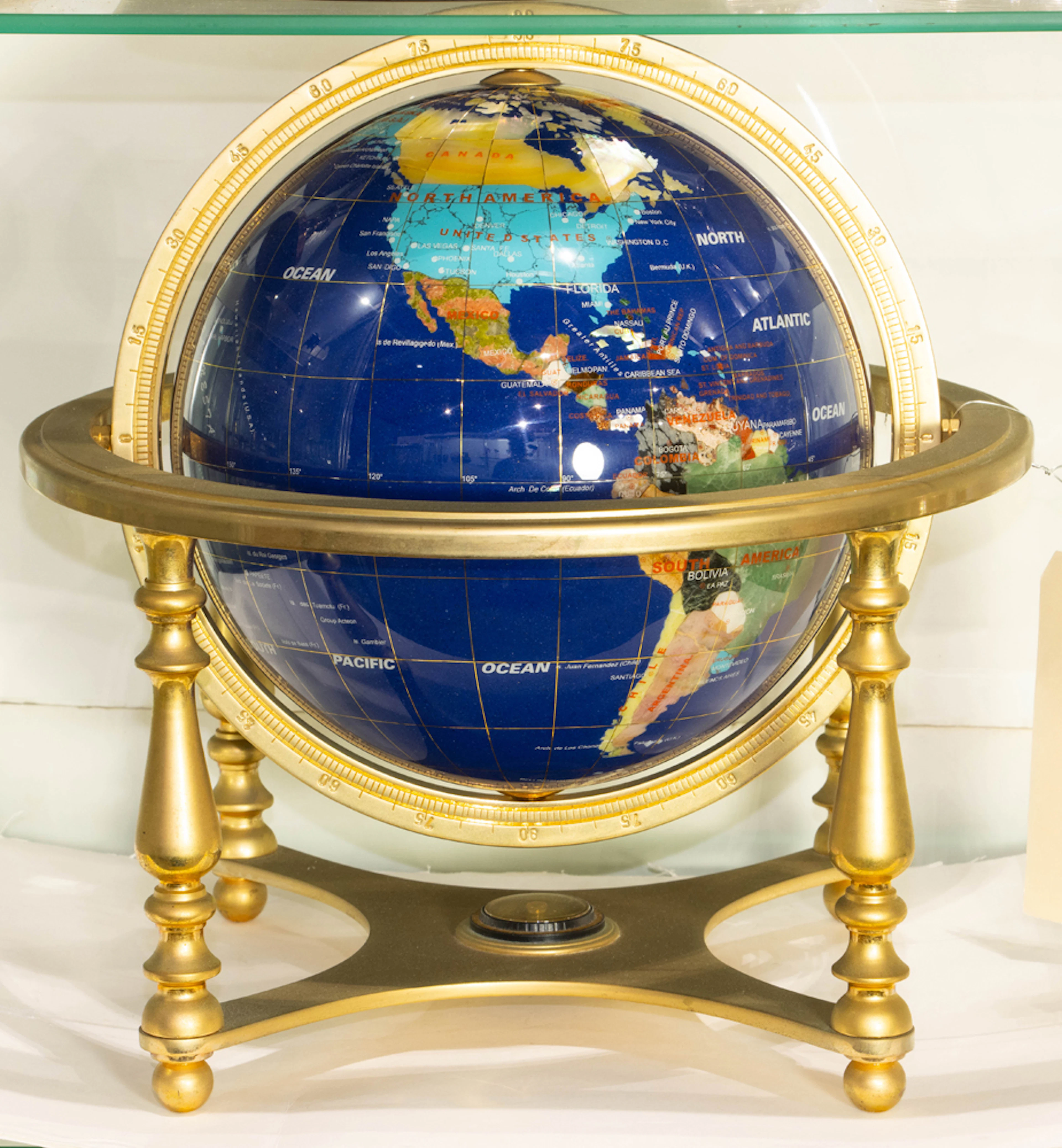 A hardstone inlaid table globe on brass frame