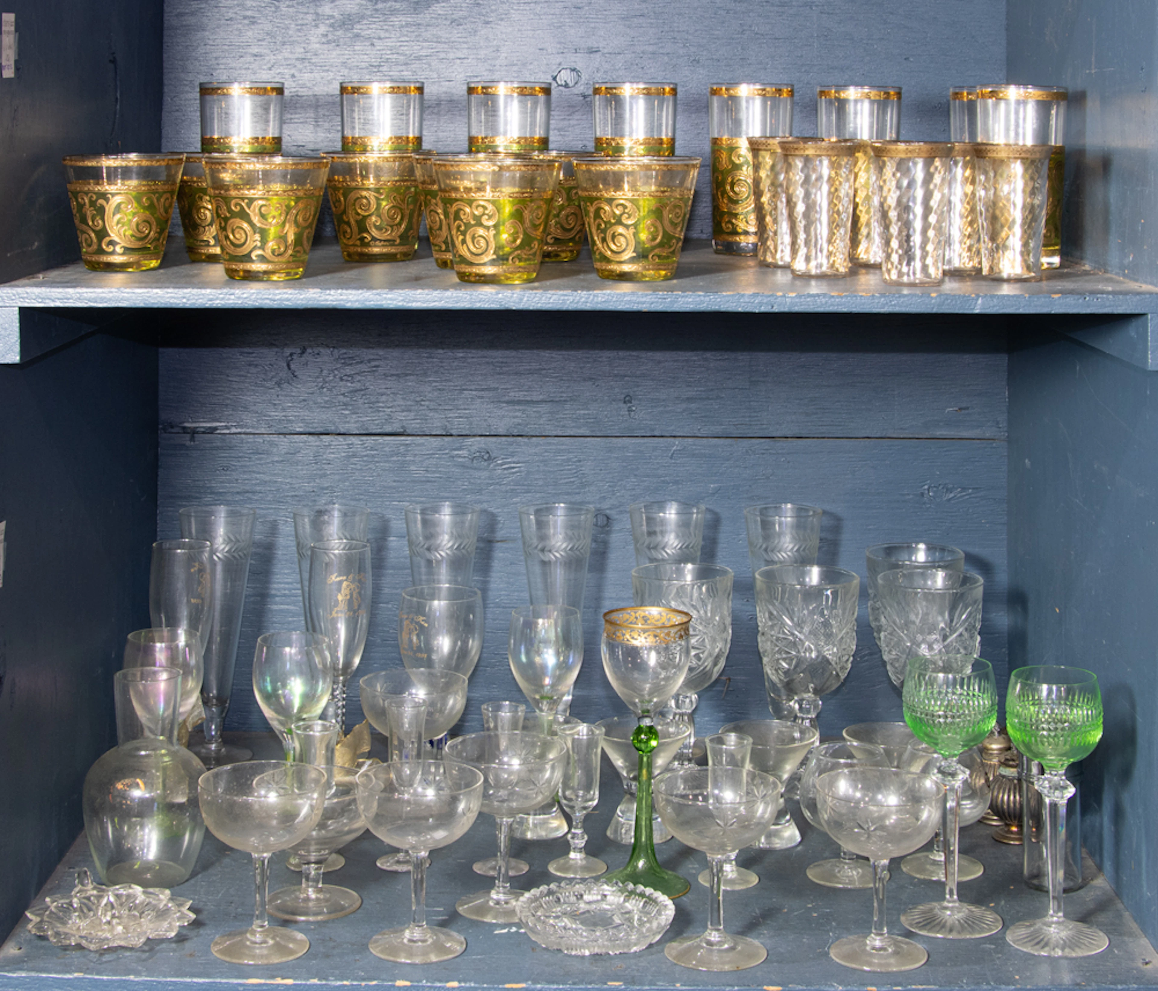 An assembled group of moslty glassware