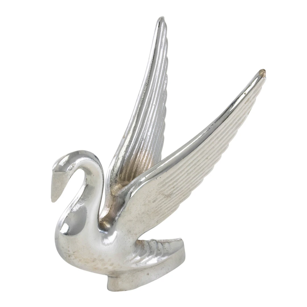 A chromed metal swan hood ornament