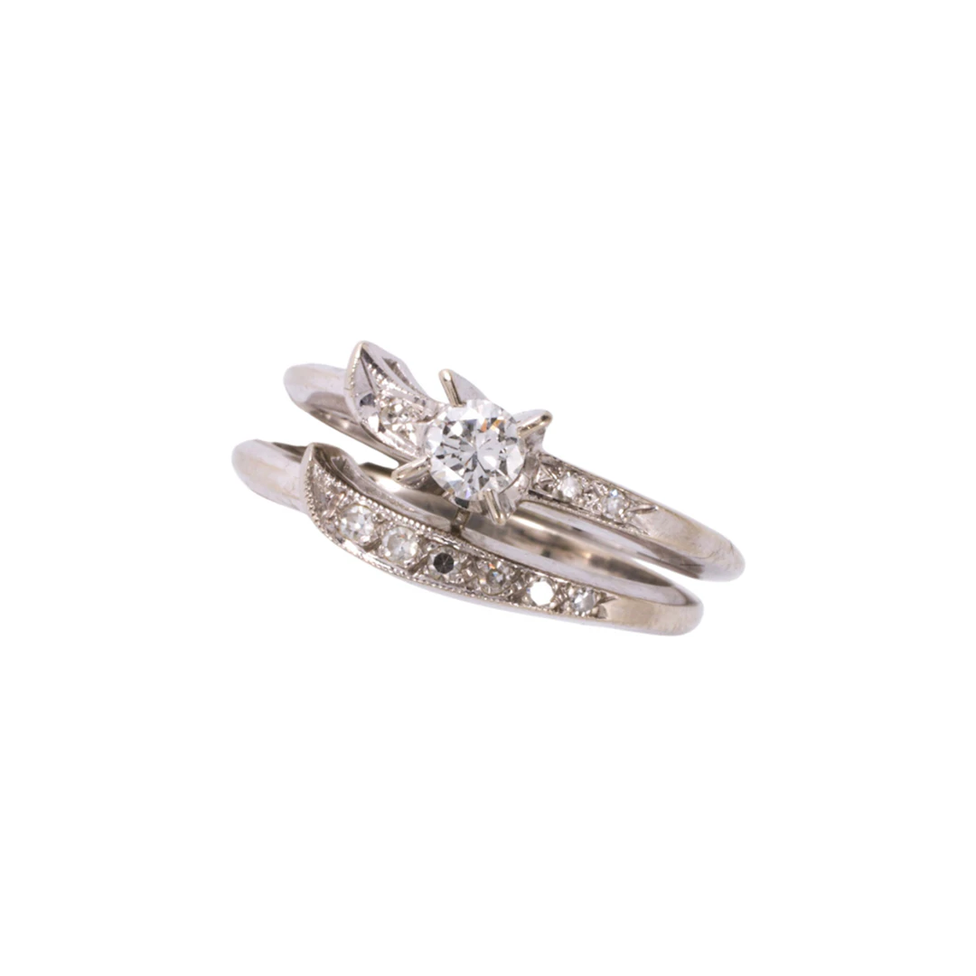 A diamond and 14k white gold wedding set