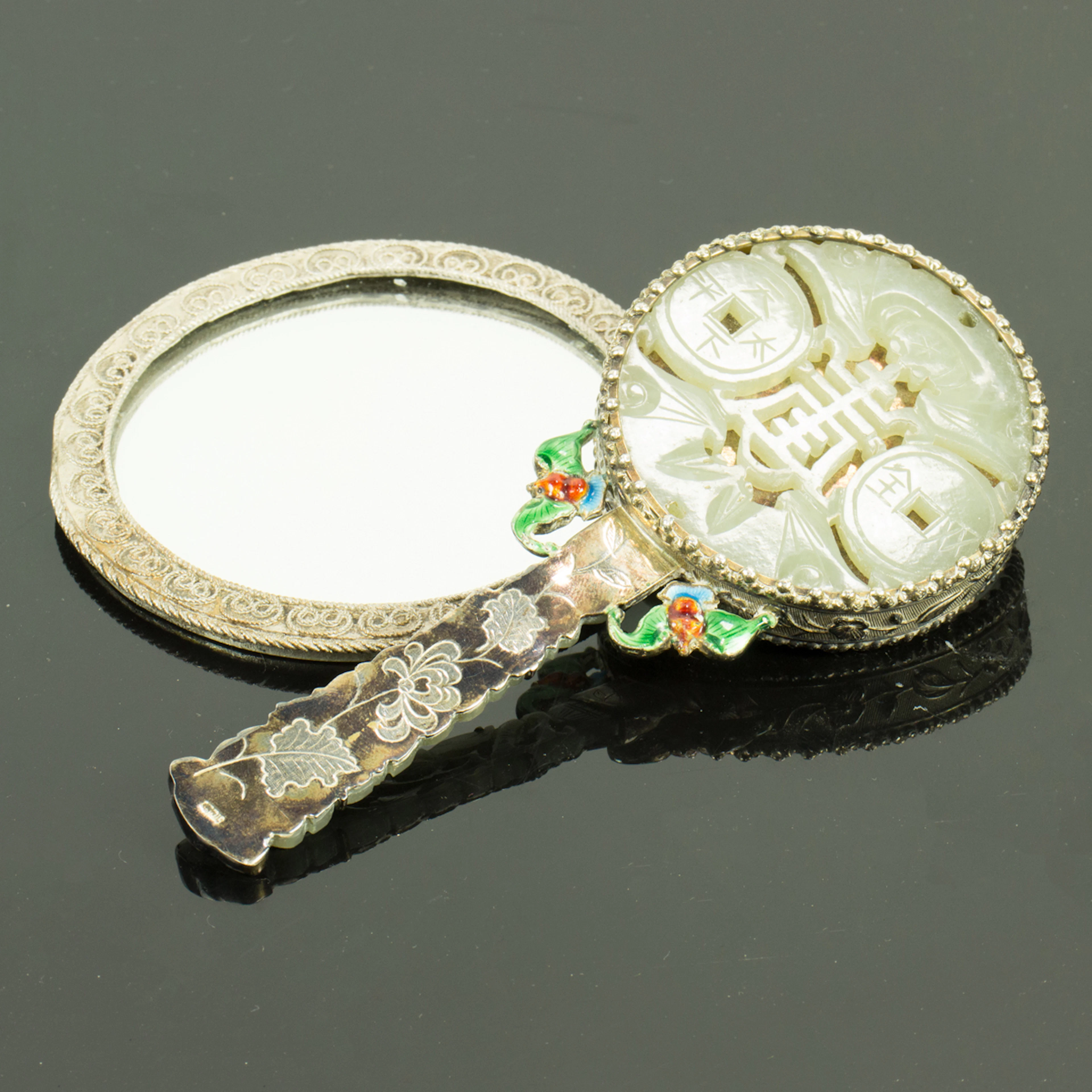 A Chinese silver and jade inlaid hand mirror