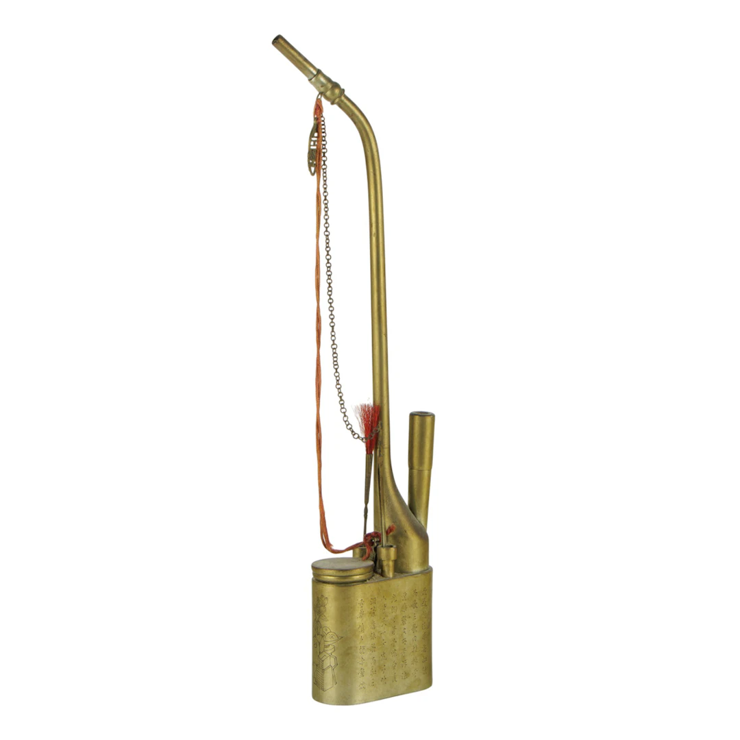 A Chinese brass opium pipe