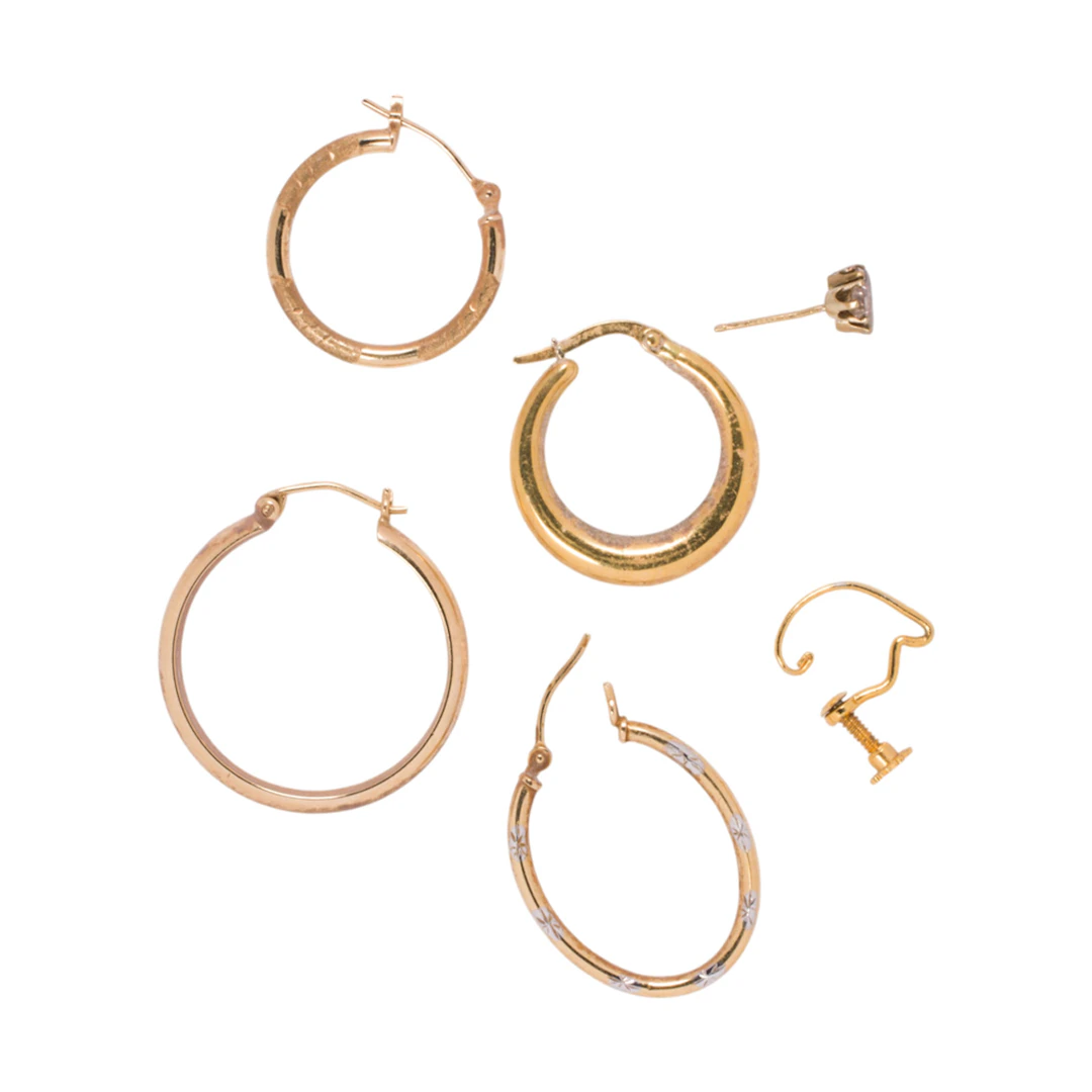 A group of single gold earrings