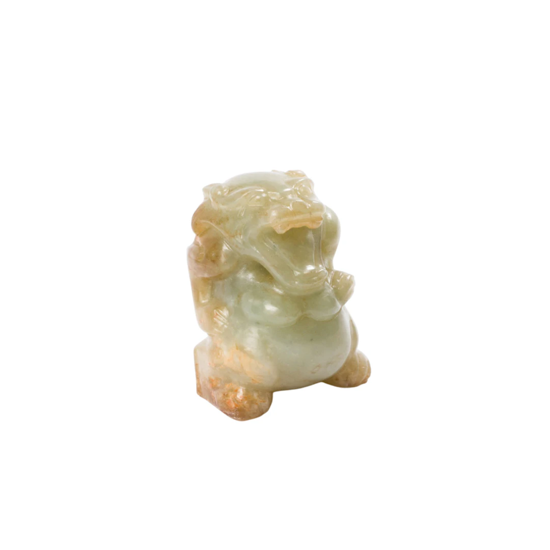 A Chinese celadon jade mythical beast figure