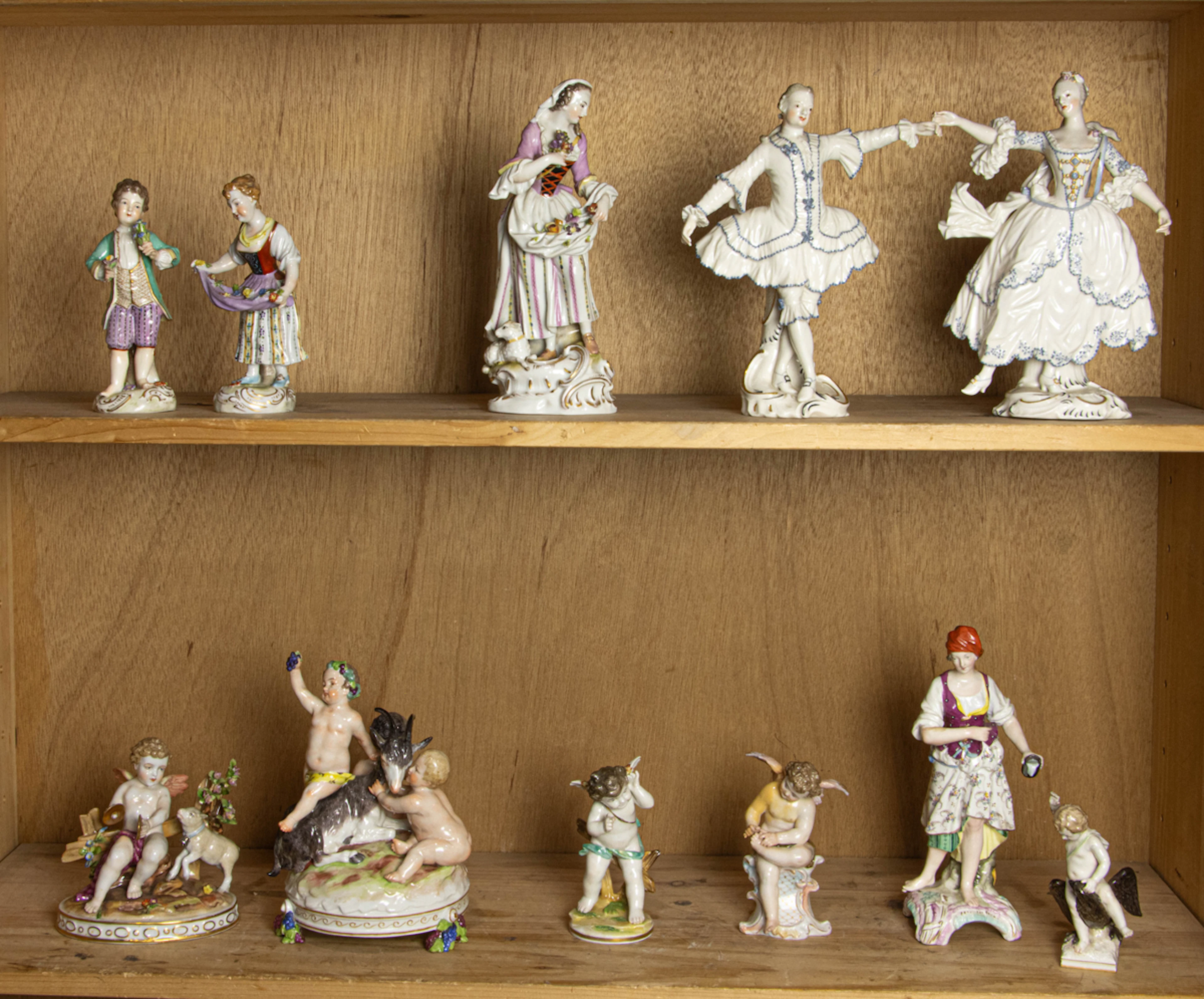 An assembled group of mainly Continental porcelain figures