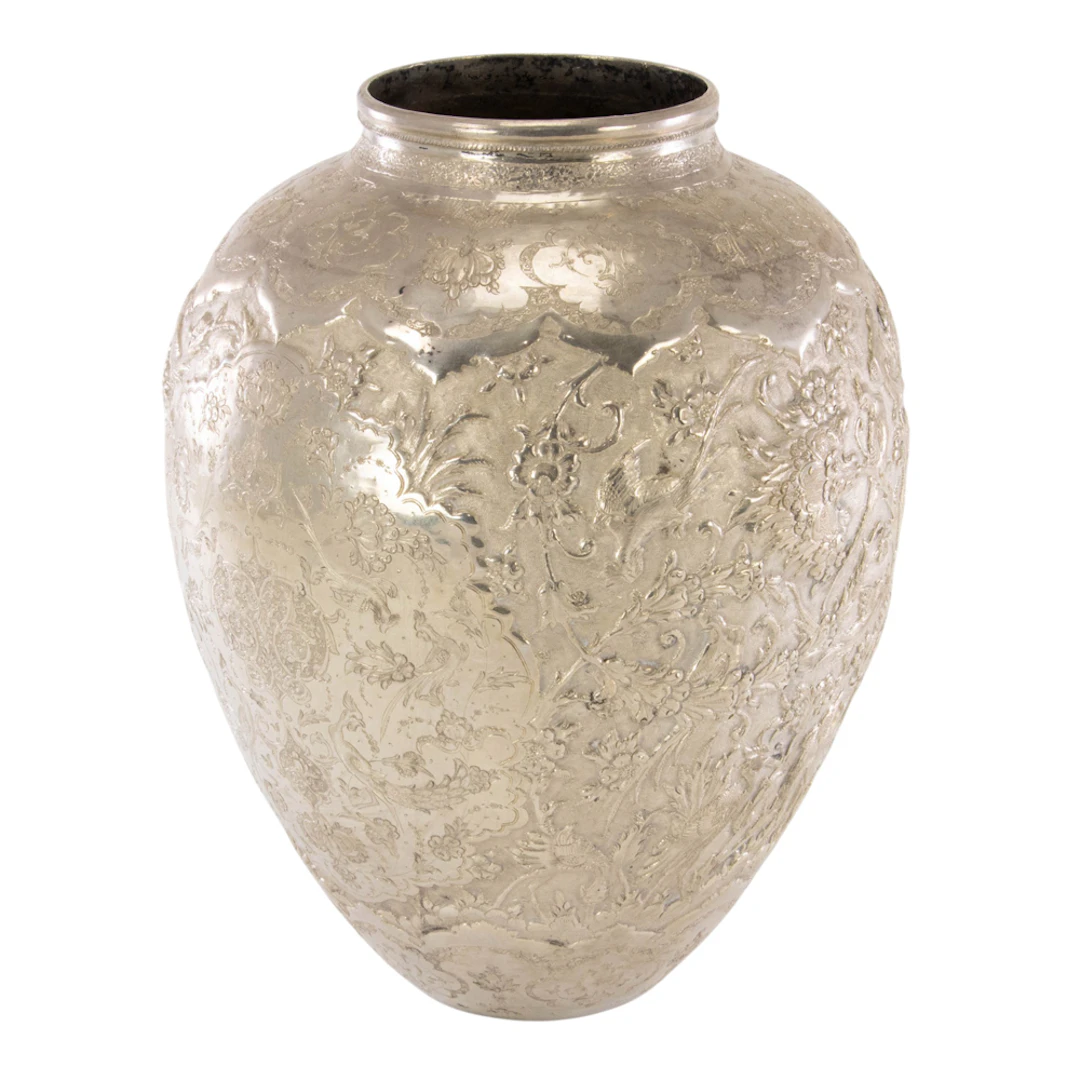 A Persian hand wrought 84 standard silver temple vase with traditional