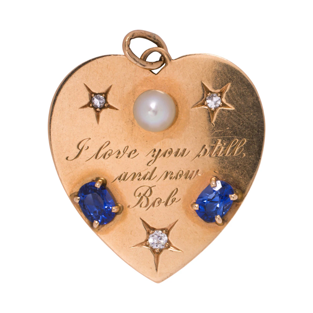 A gem-set and 14k gold heart pendant