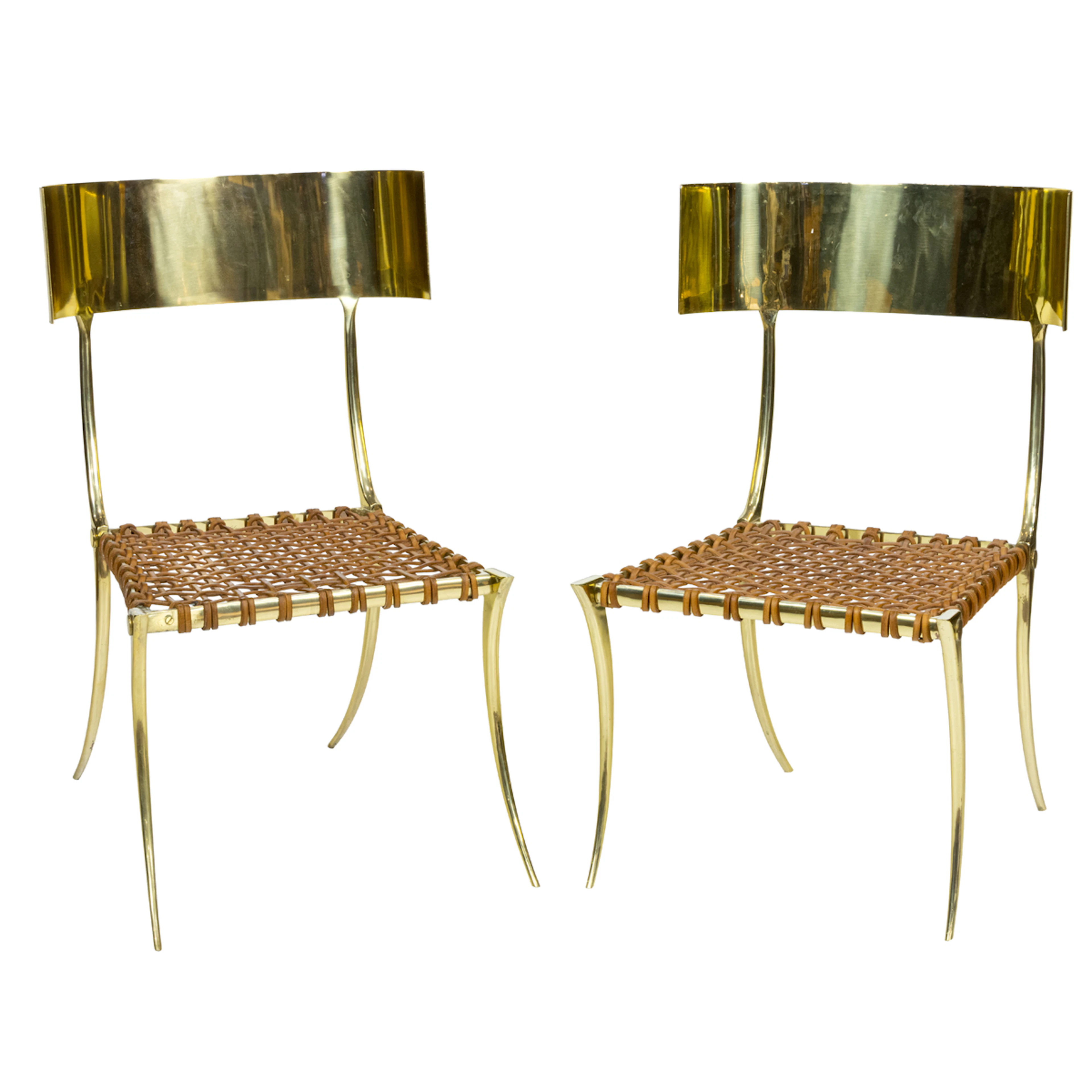 A pair of custom solid cast brass Klismos chairs