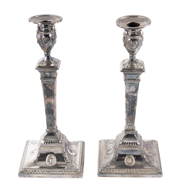 A silver plated pair of Neoclassical candlesticks