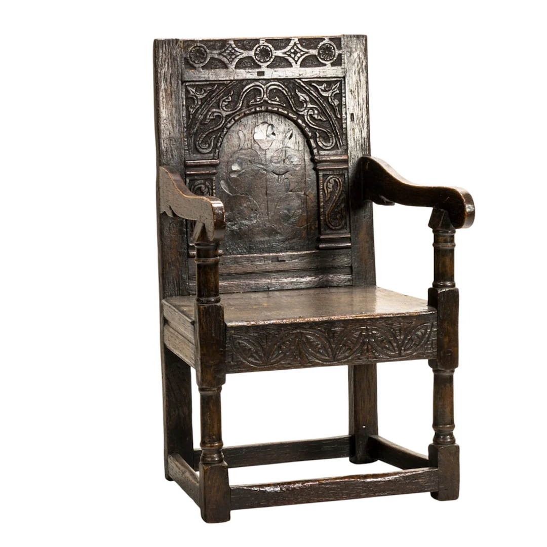 An English Charles I carved and inlaid wainscot chair