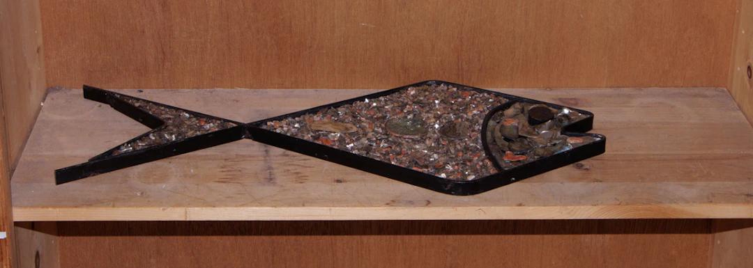 A Mid Century Mexican abalone shell inlaid plaque of a fish