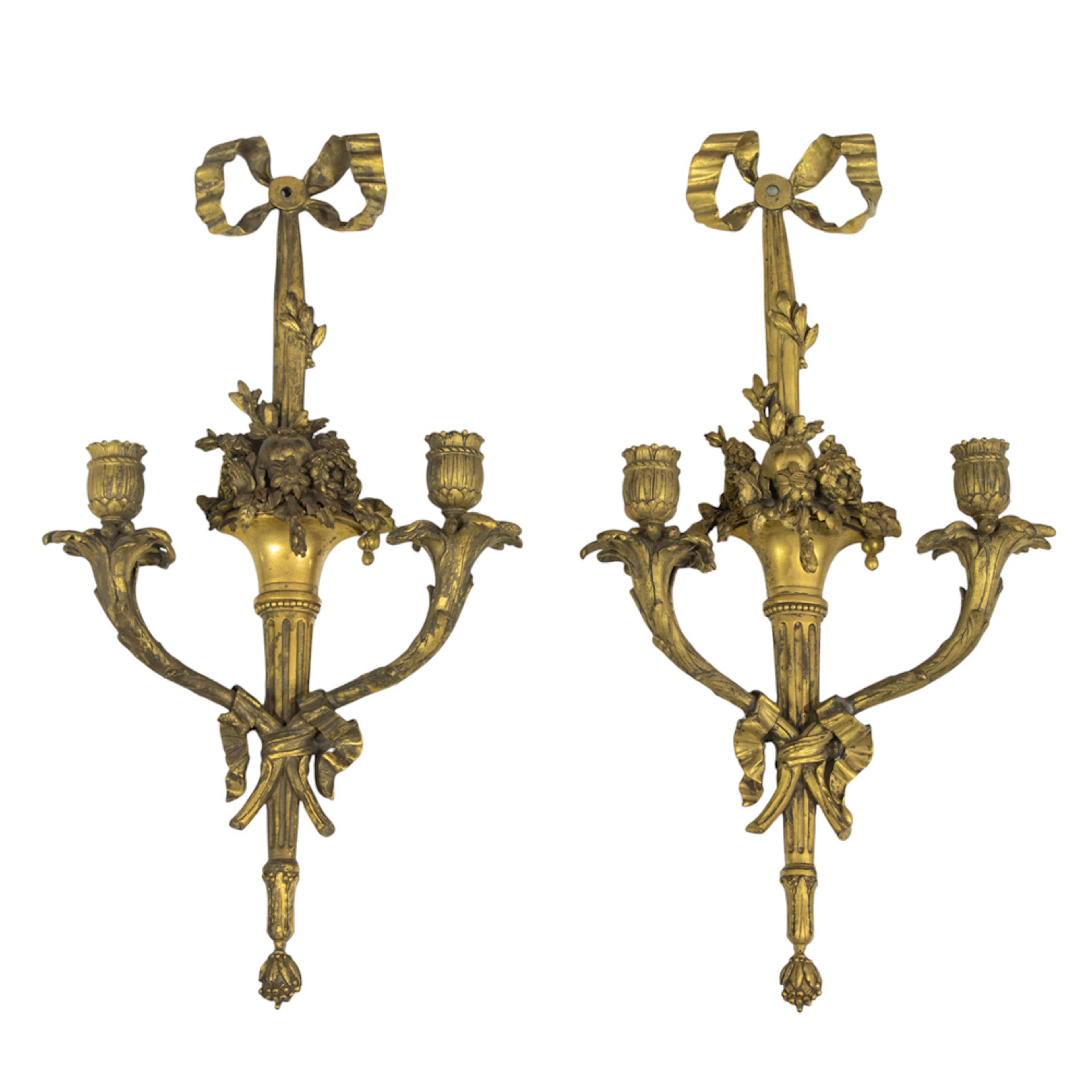 A pair of Neoclassical style gilt bronze two-light wall sconces