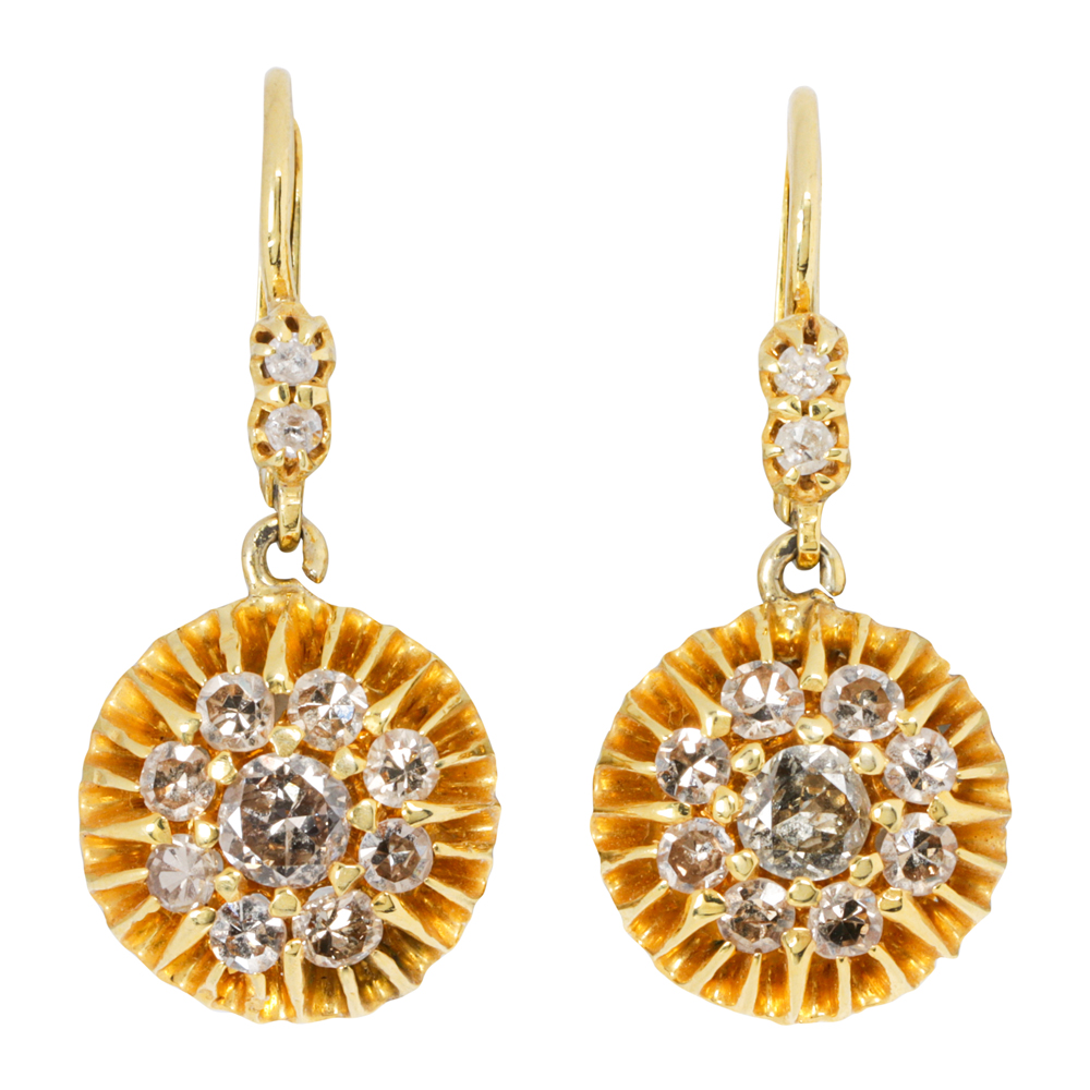 A pair of diamond and gold earrings