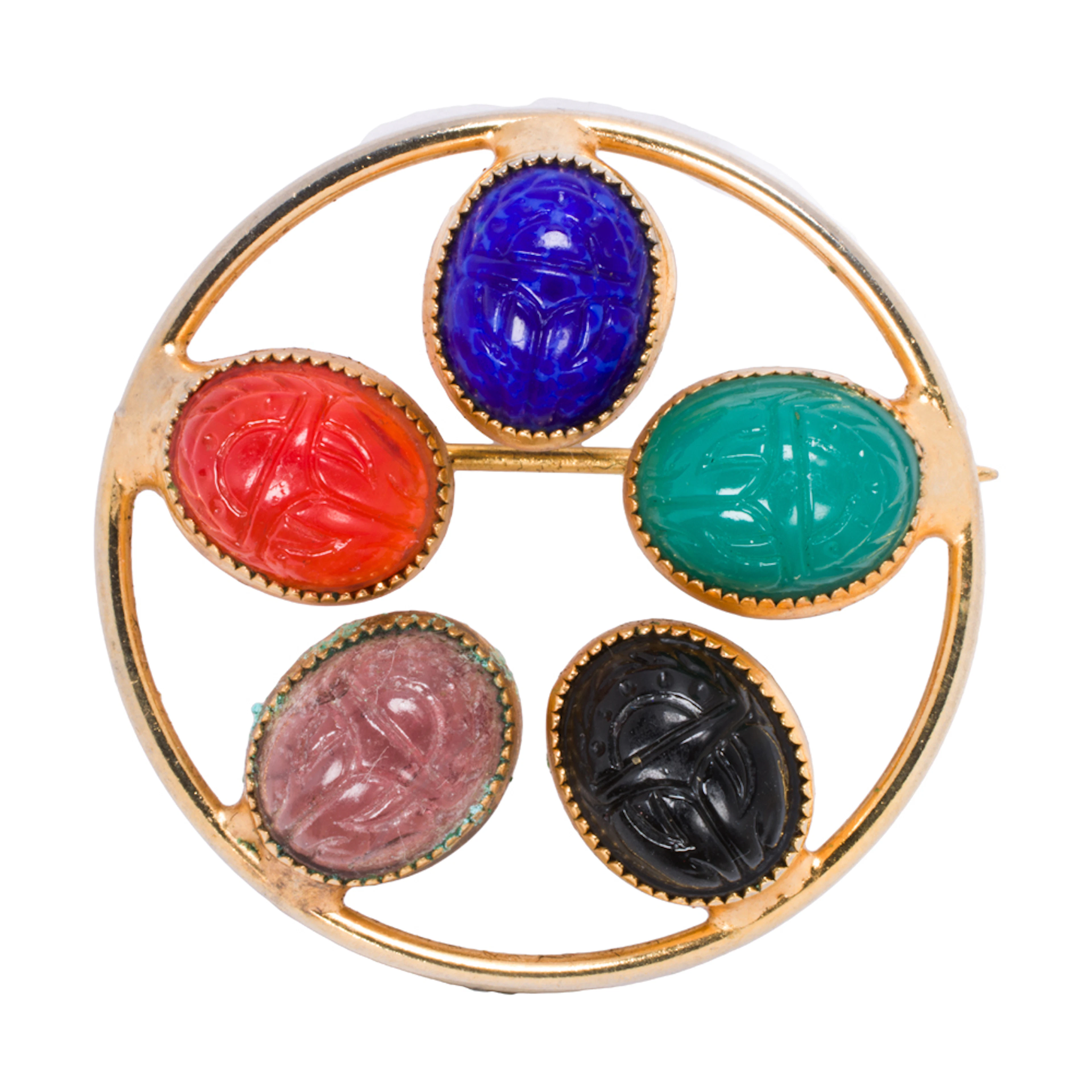 A gemstone and 10k gold brooch
