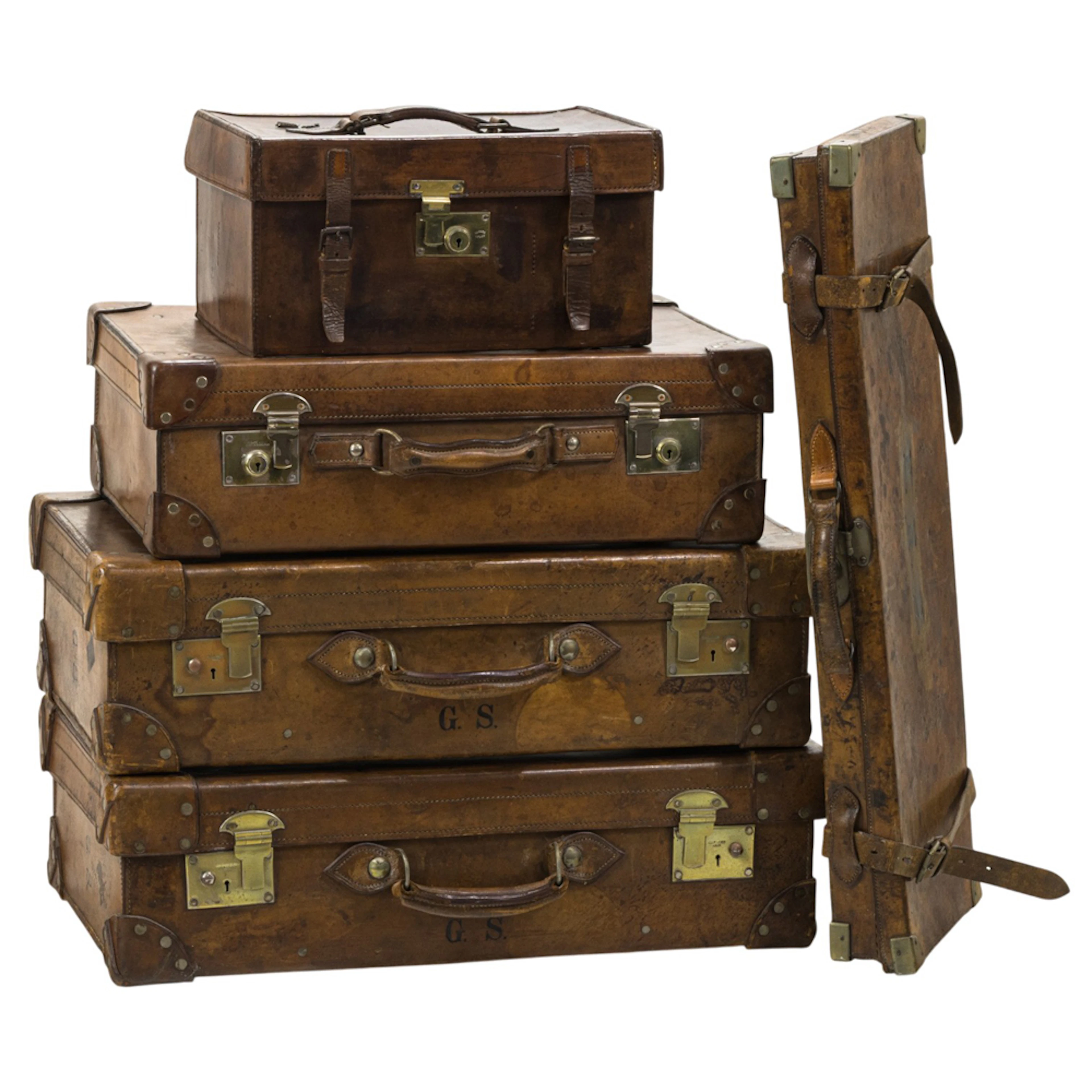 A group of five English leather travel cases