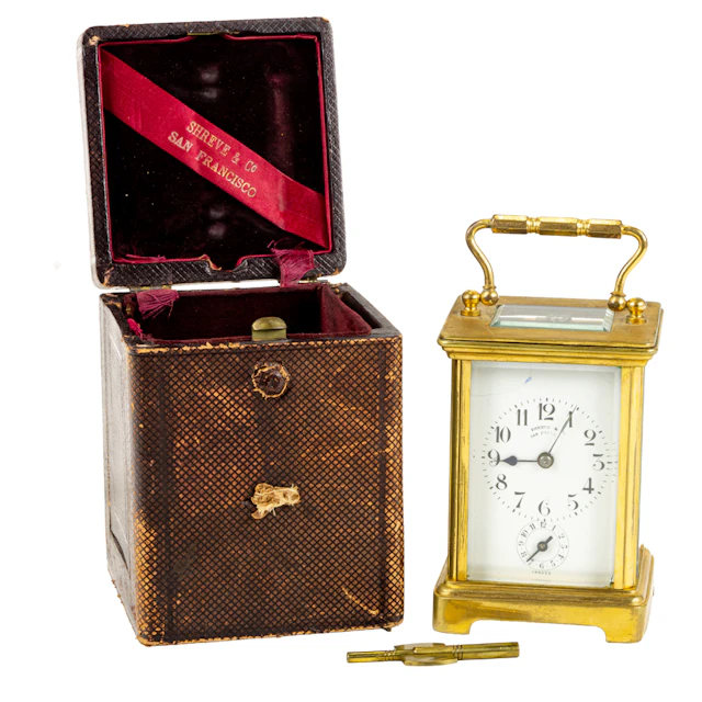 A French gilt brass and glass alarm carriage clock retailed by Shreve & Co.