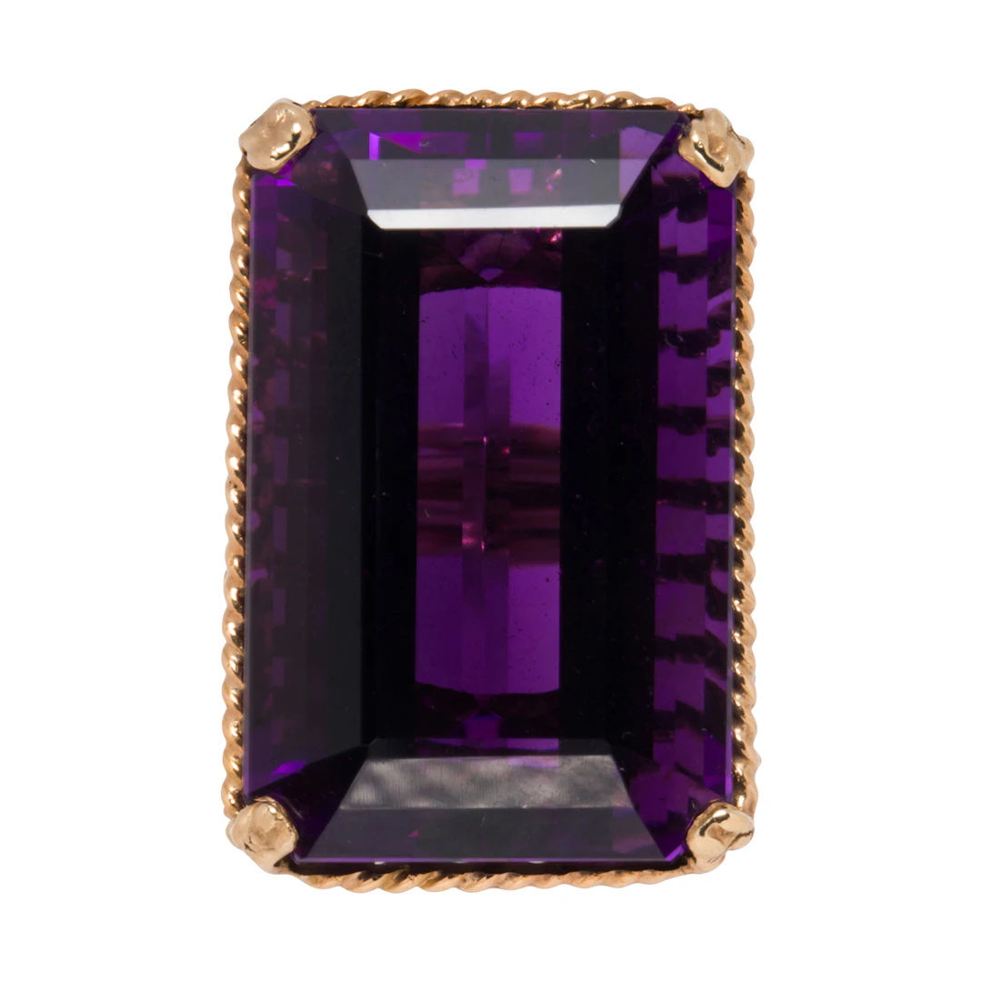 An amethyst and 14k gold ring