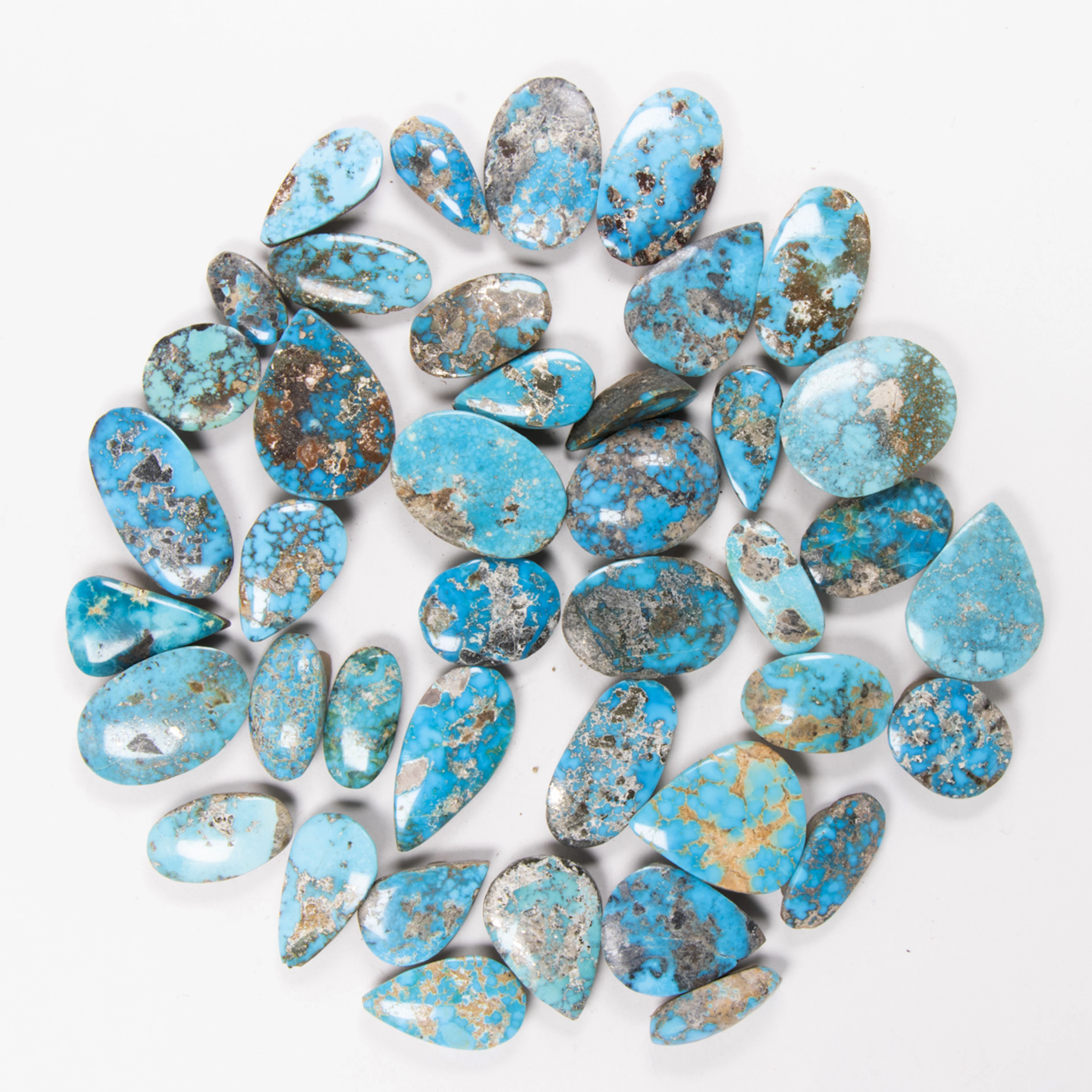 A bag of turquoise cabochons