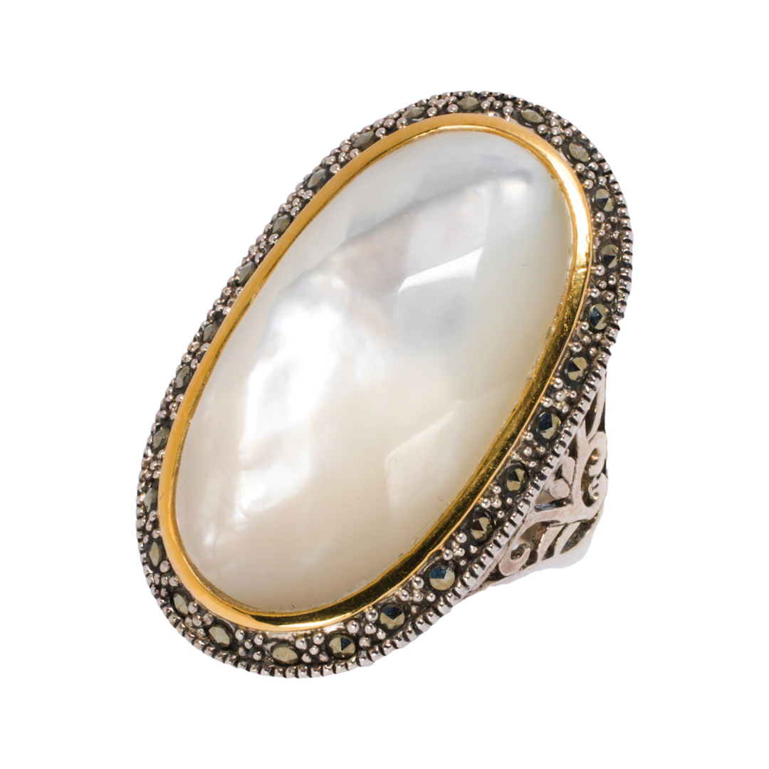 A mother of pearl, silver and 14k gold ring