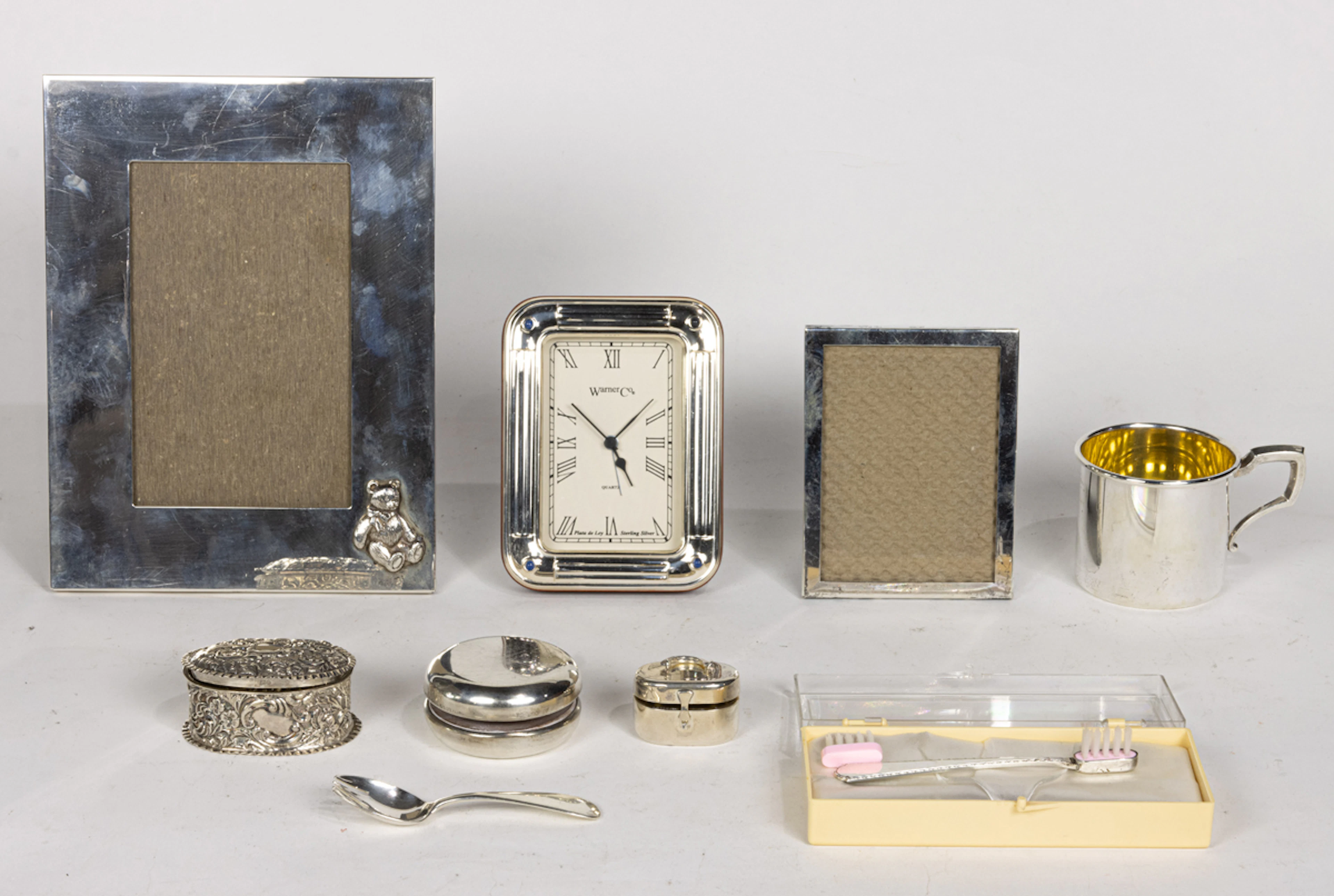 A group of sterling baby gift items