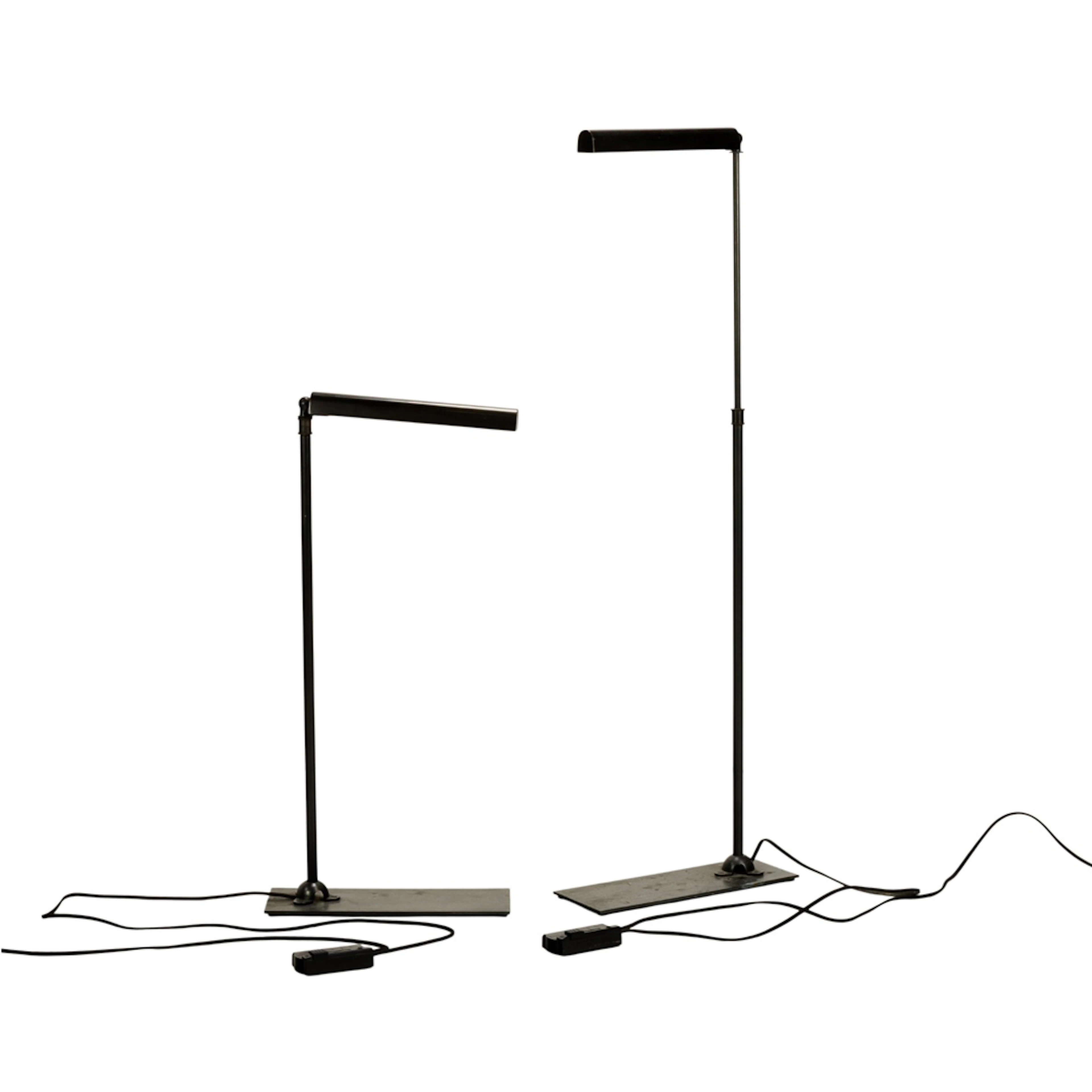 A pair of Restoration Hardware slimline task floor lamps