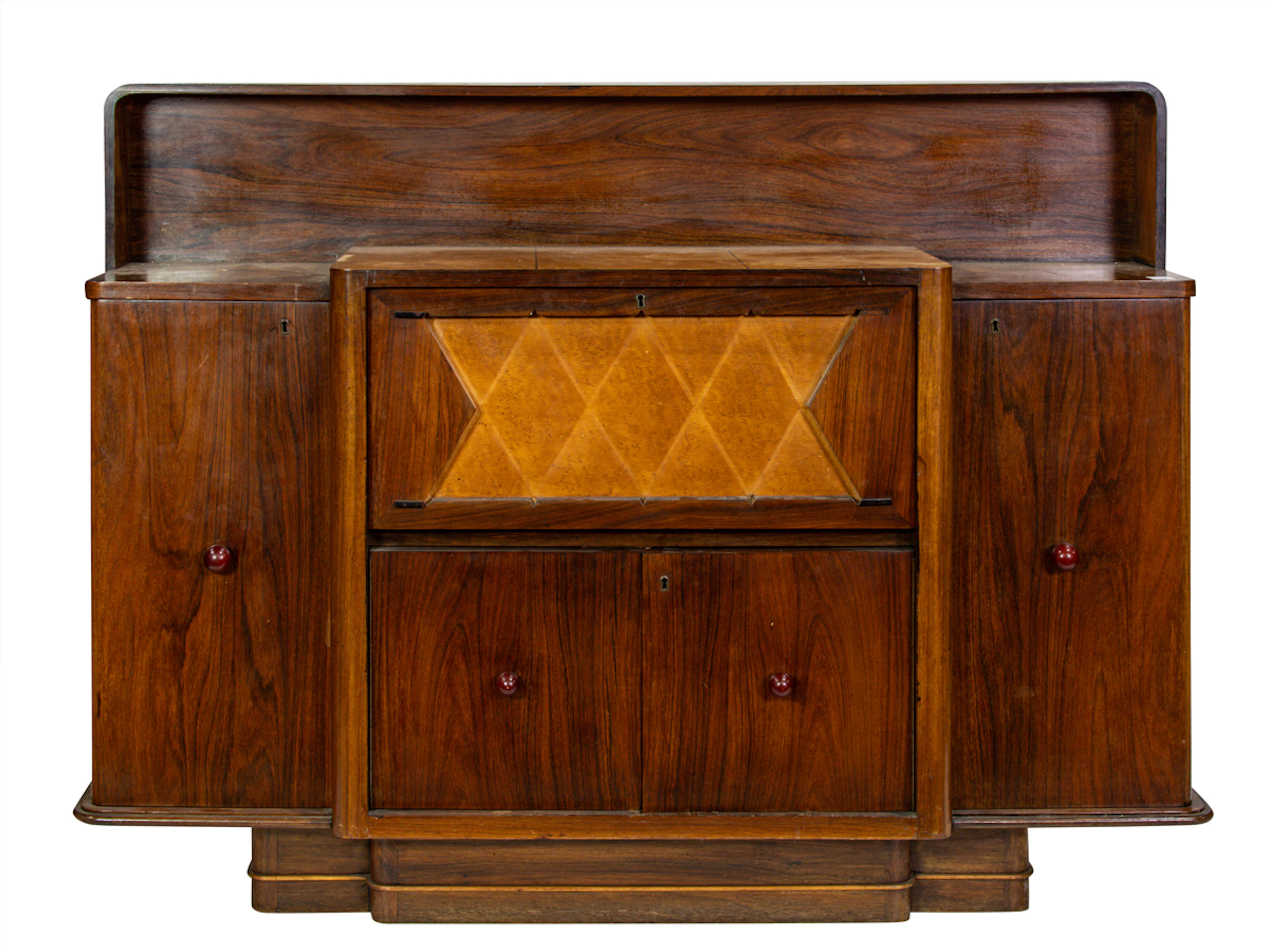 An Italian Mid-Century Modern rosewood bar cabinet designed by Osvaldo Borsani