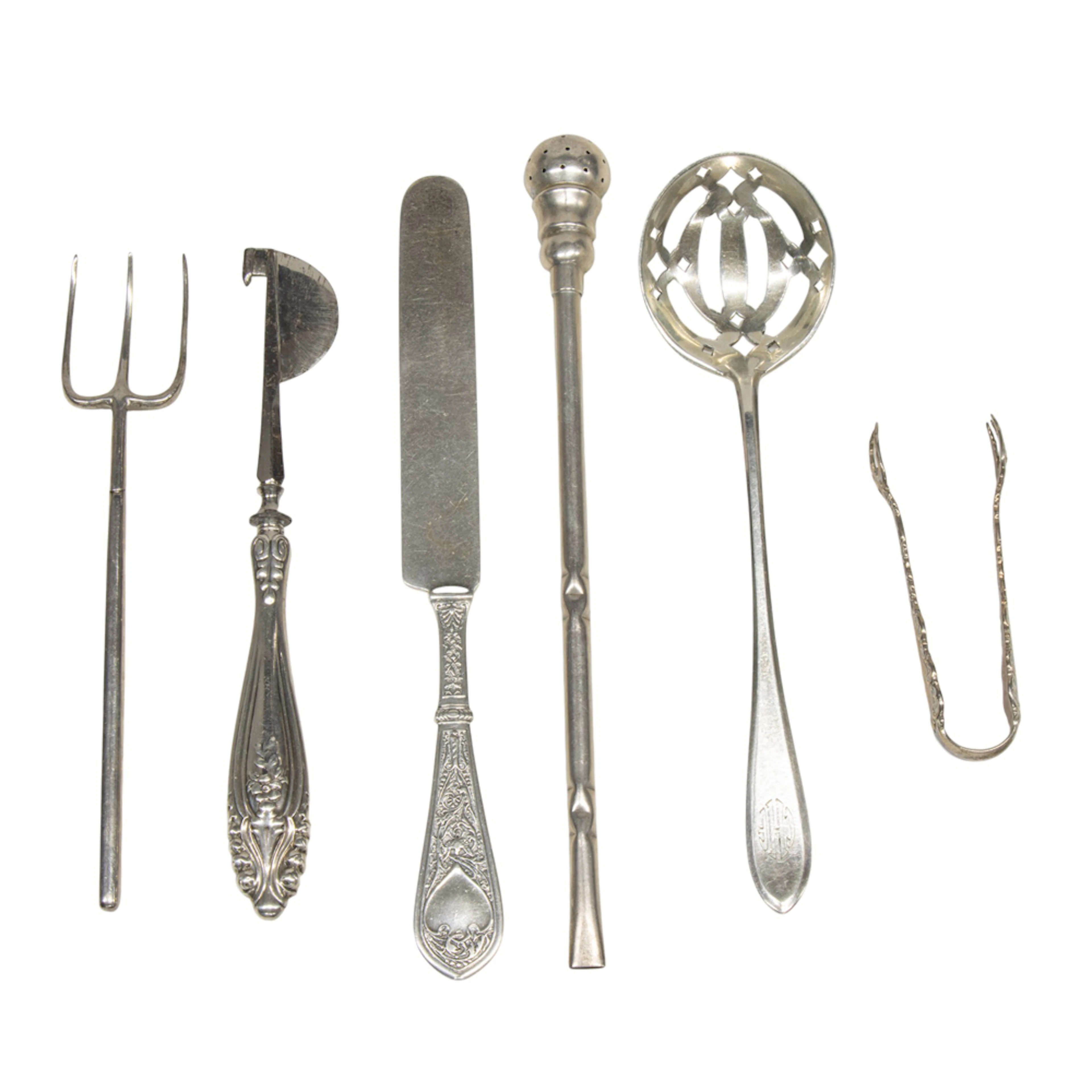 A group of sterling flatware
