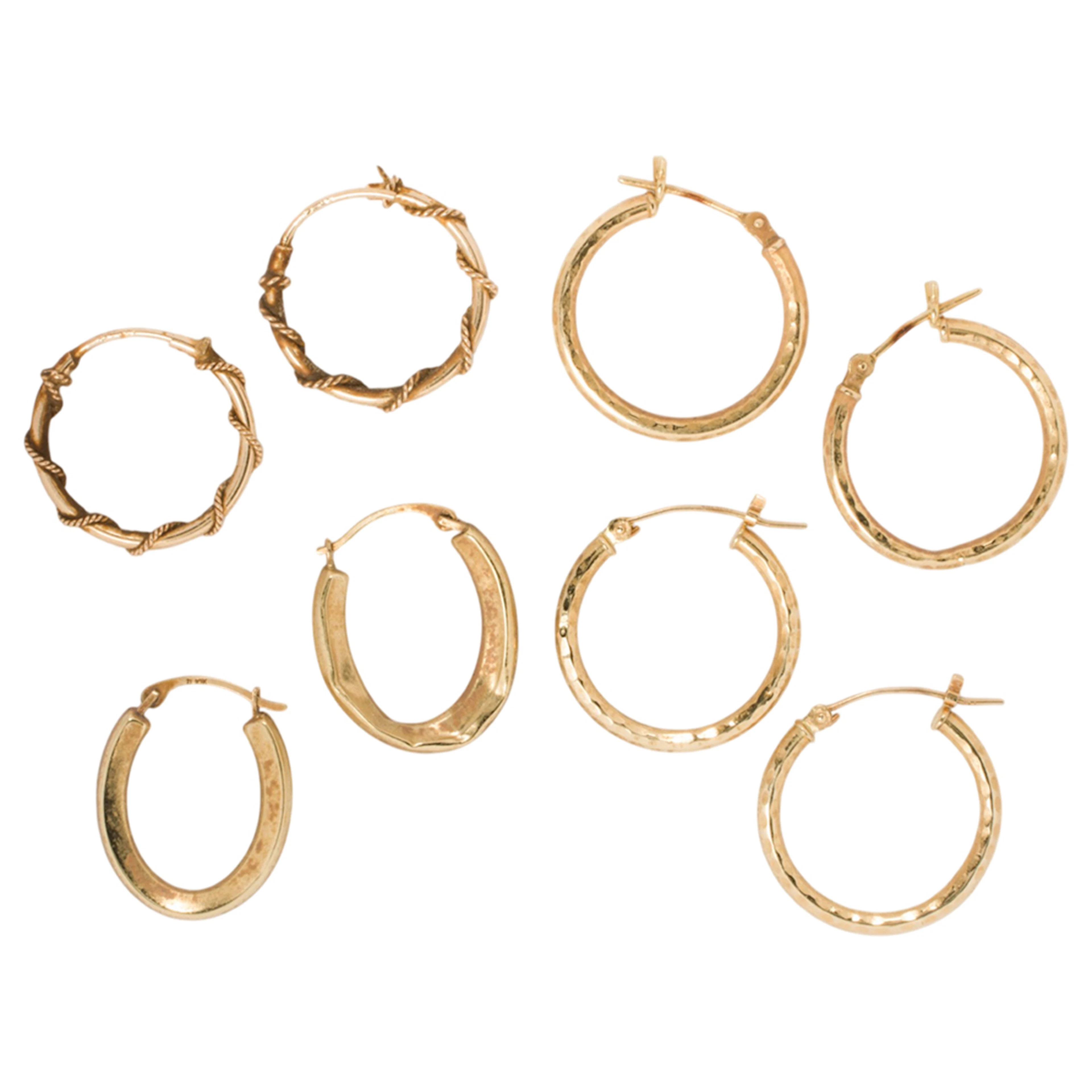 Four pairs of 14k gold hoop earrings
