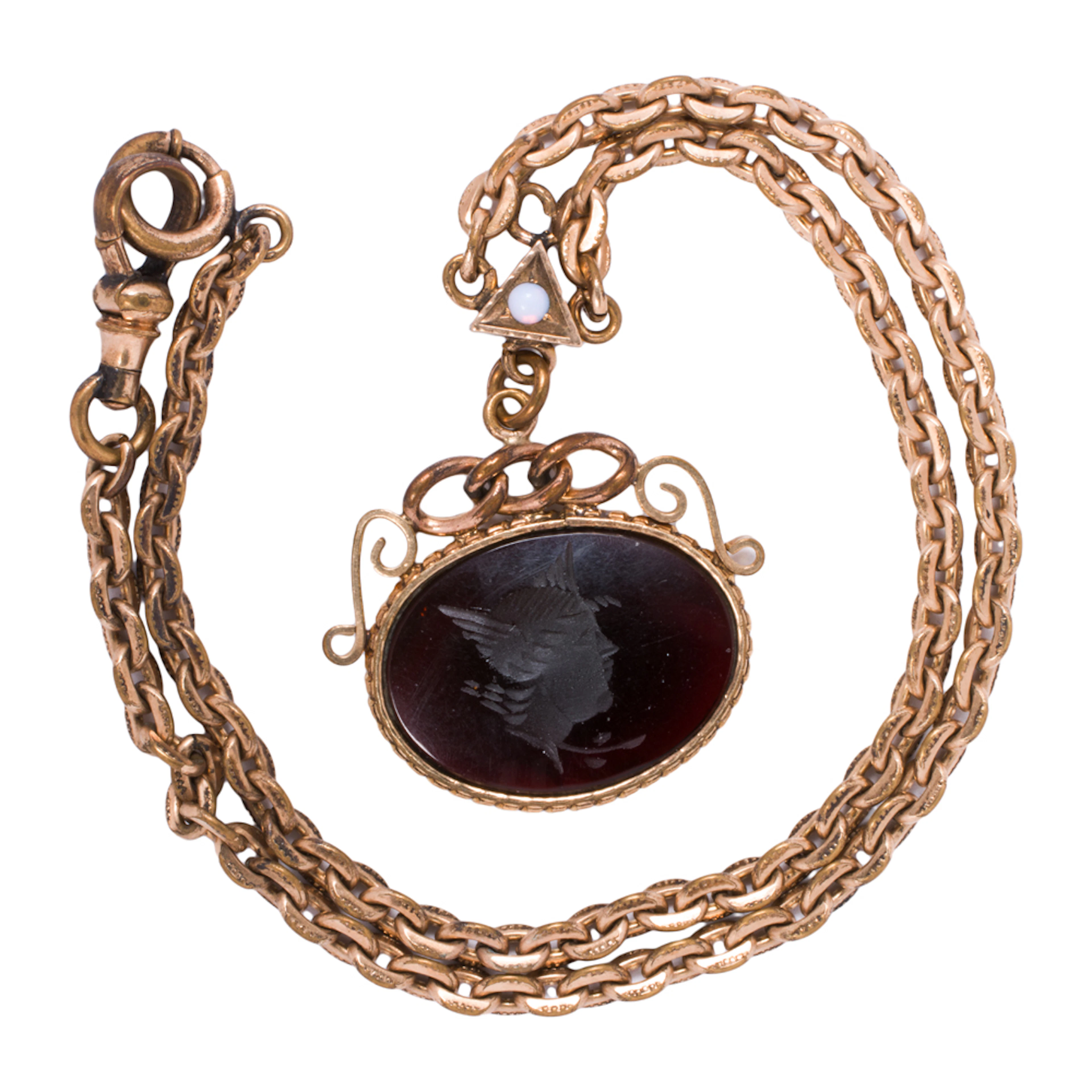 An antique gold-filled chain and fob