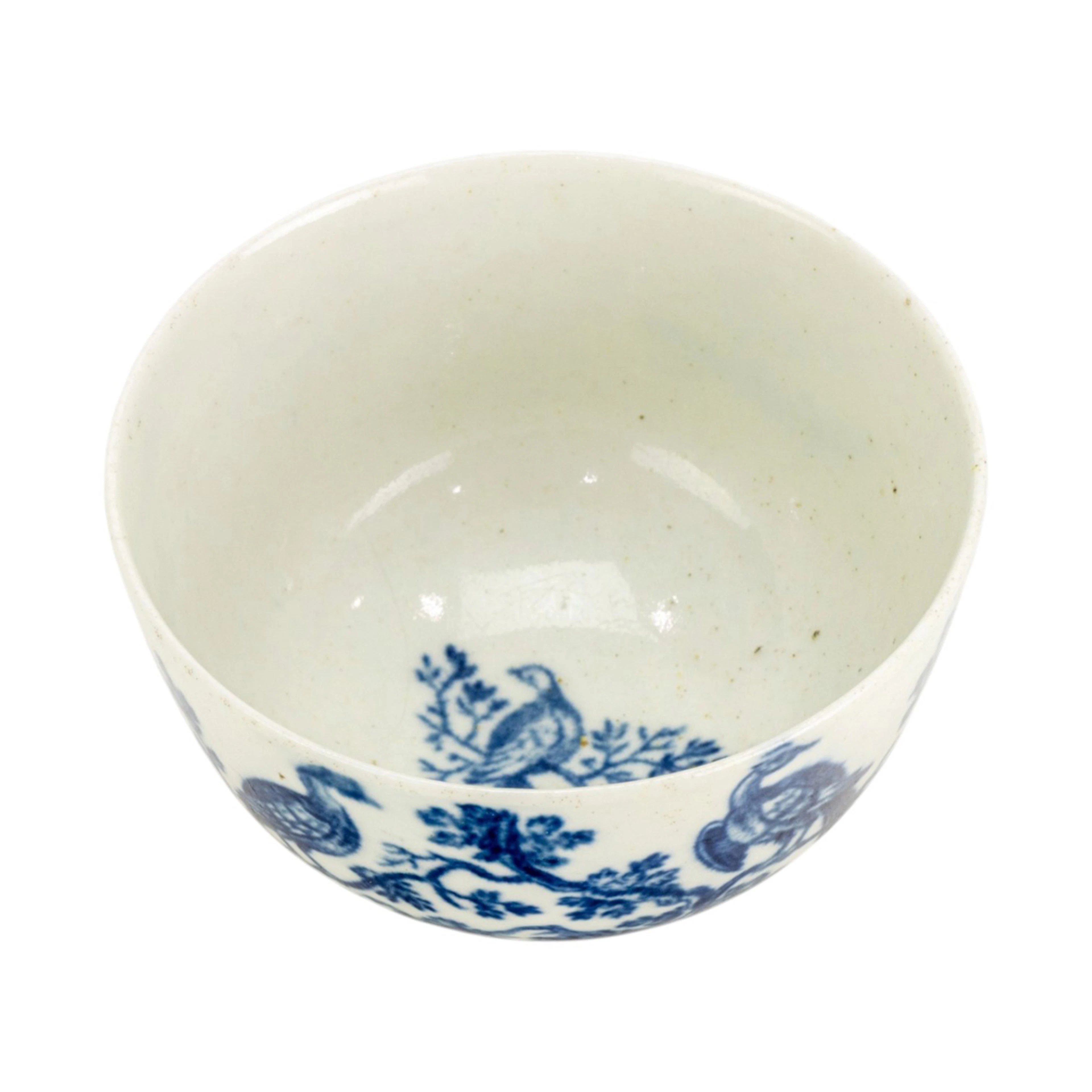 A Worcester porcelain blue and white printed tea bowl in the Bird