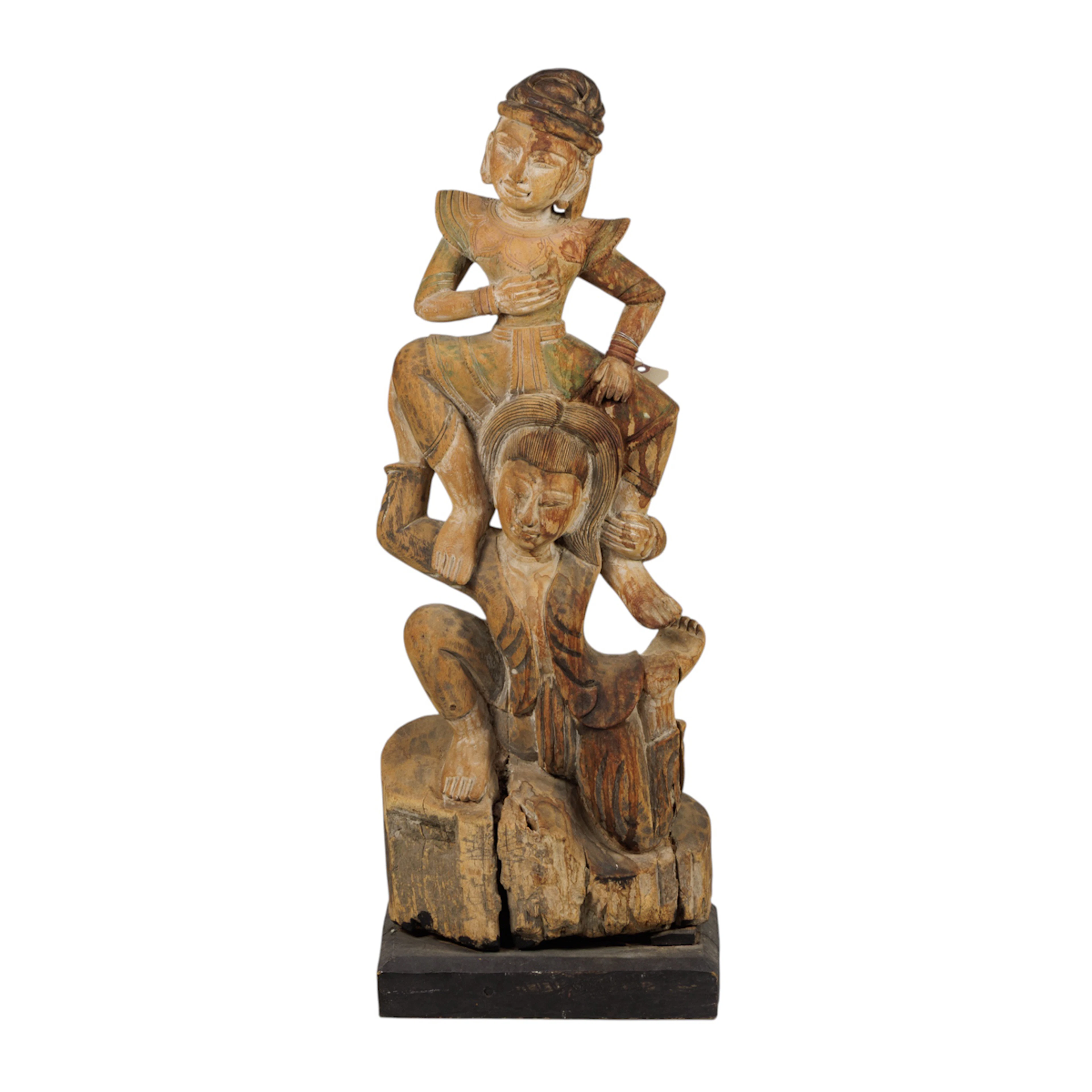 A Burmese carved wood temple figures