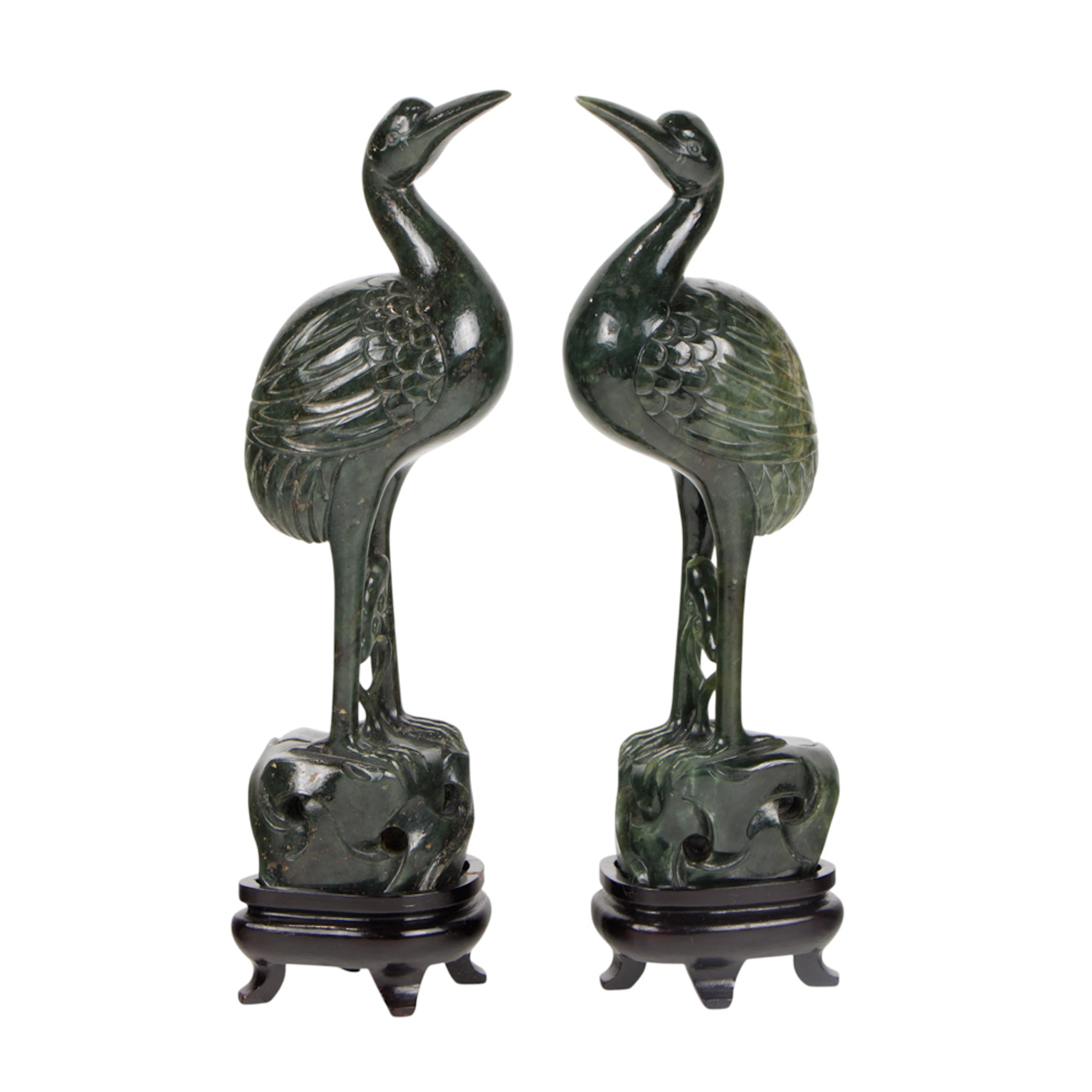 A pair of Chinese spinach jade crane figures