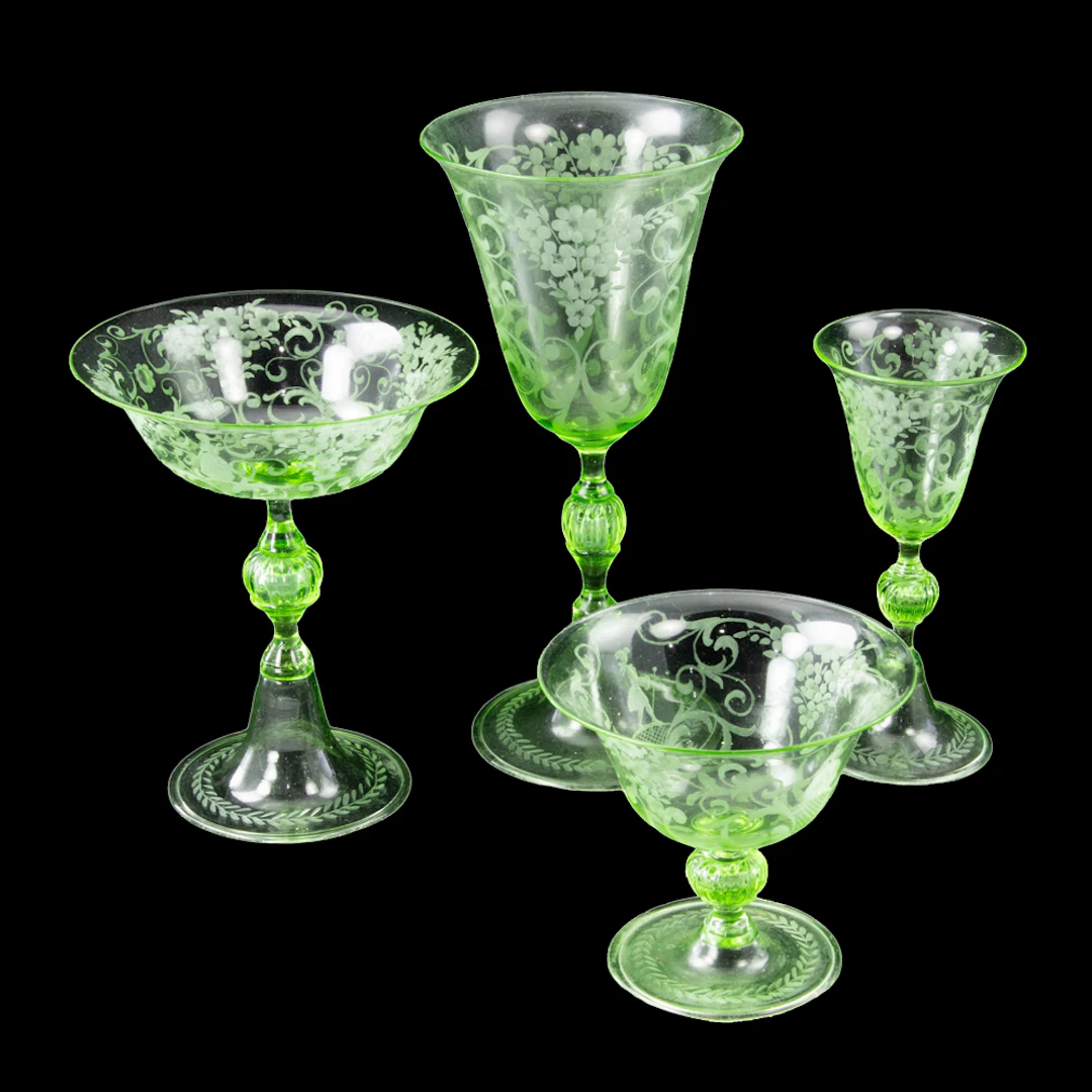 A Continental engraved green glass suite of stemware