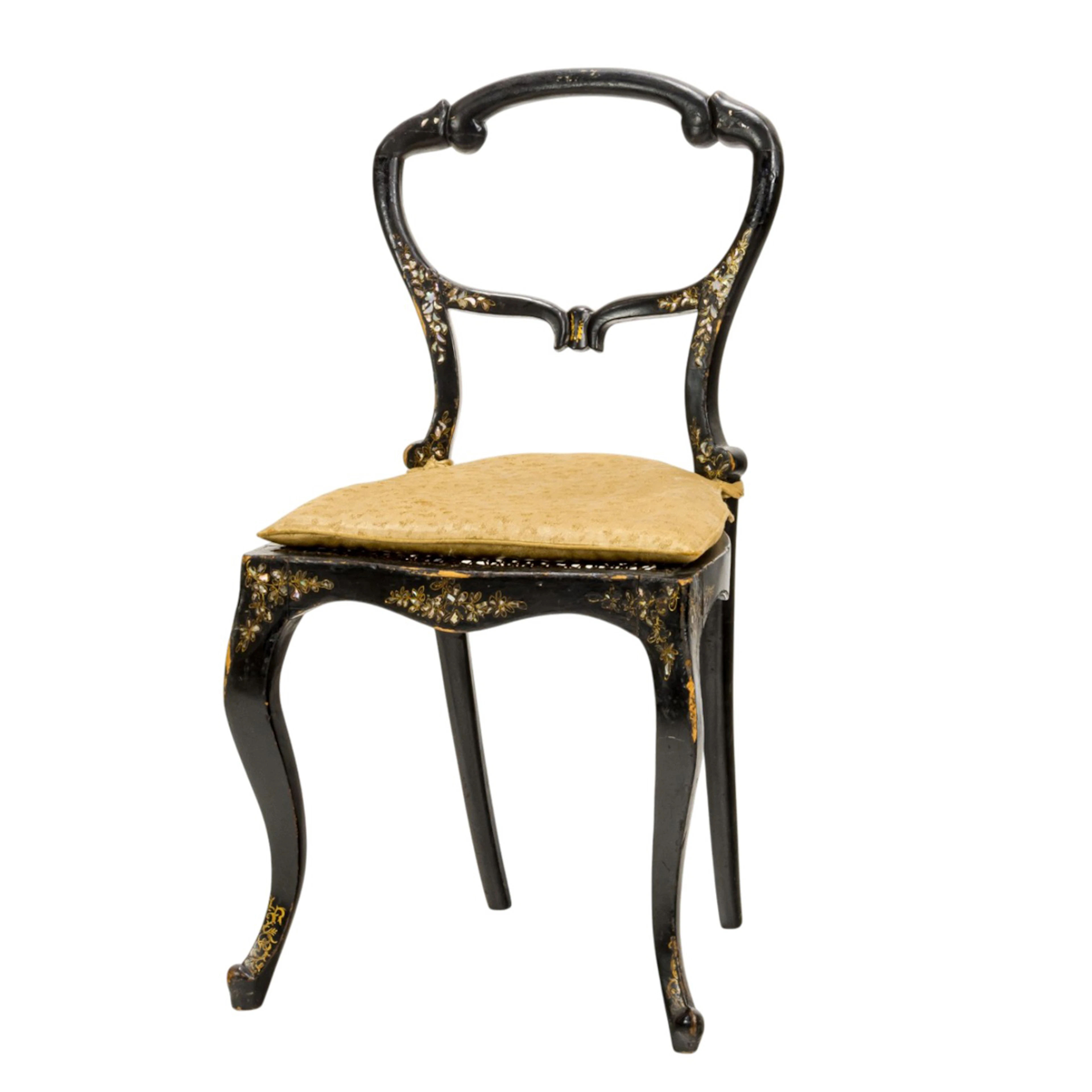A French shell inlaid ebonized side chair