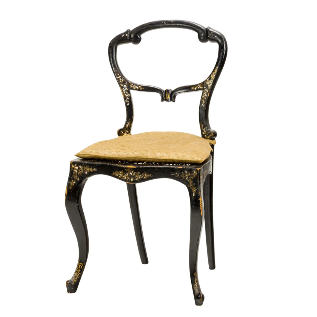 A French shell inlaid ebonized side chair
