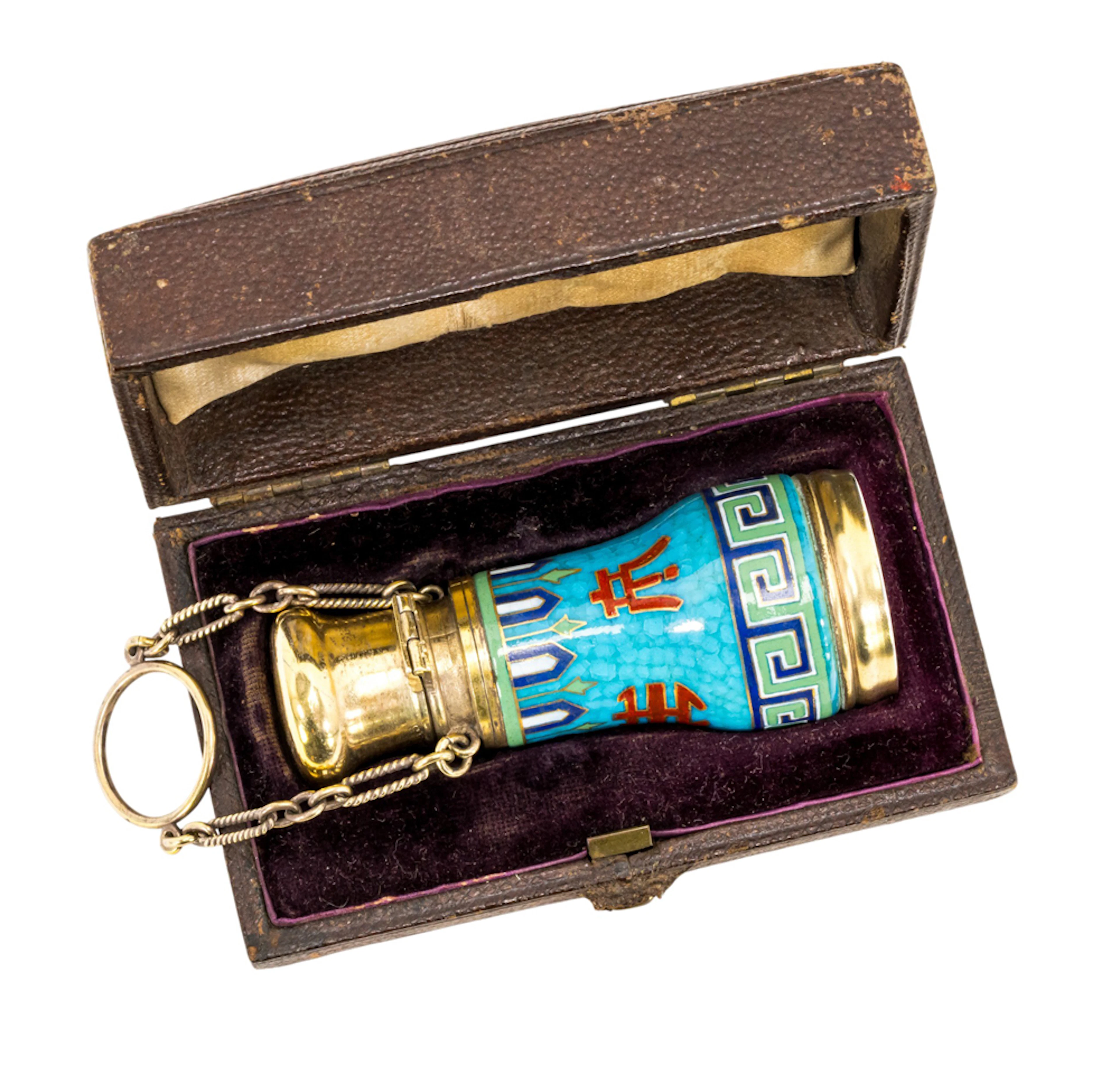 An Aesthetic Movement enameled gilt metal scent bottle with flirting