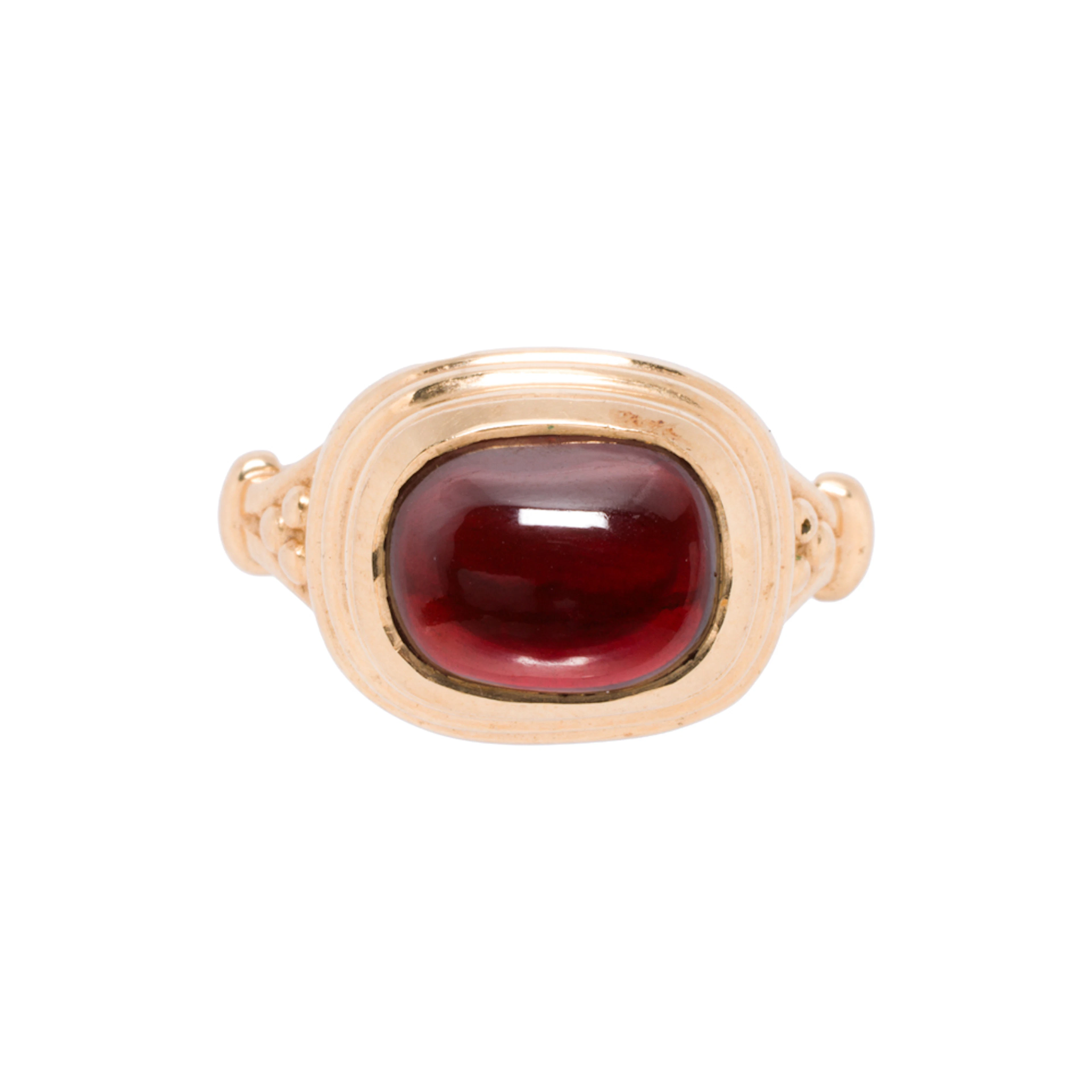 A garnet and 14k gold ring