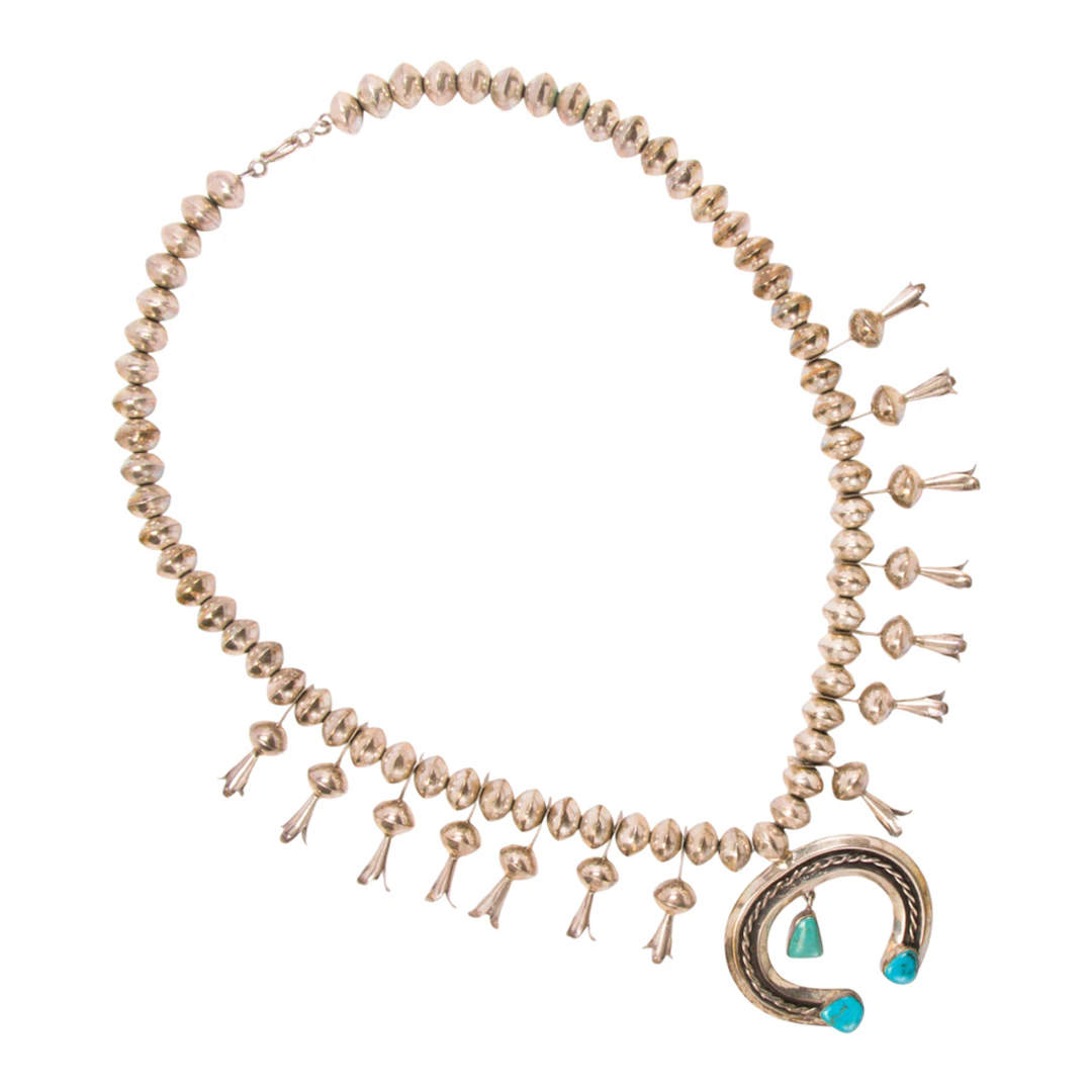 A Native American turquoise and silver squash blossom necklace