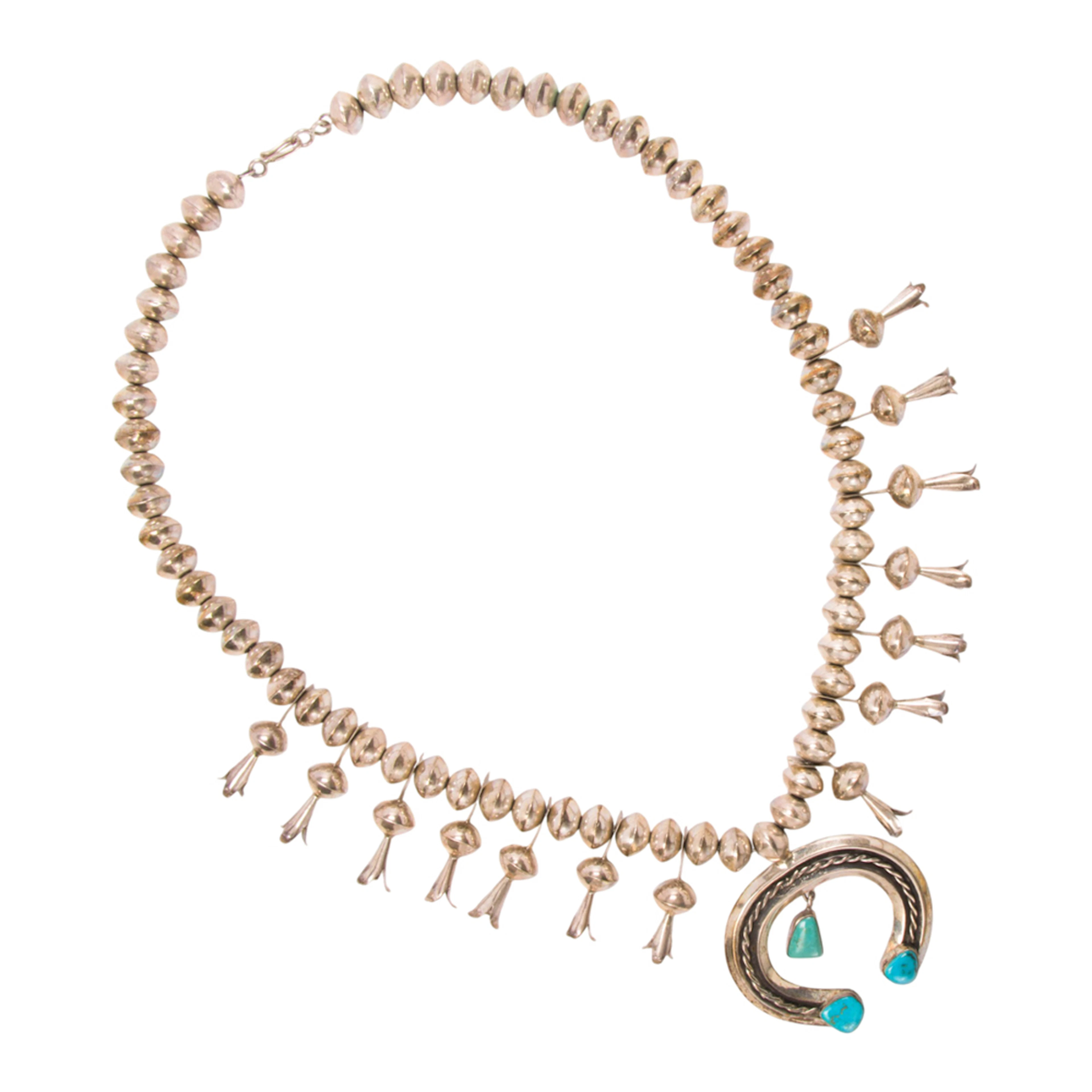 A Native American turquoise and silver squash blossom necklace