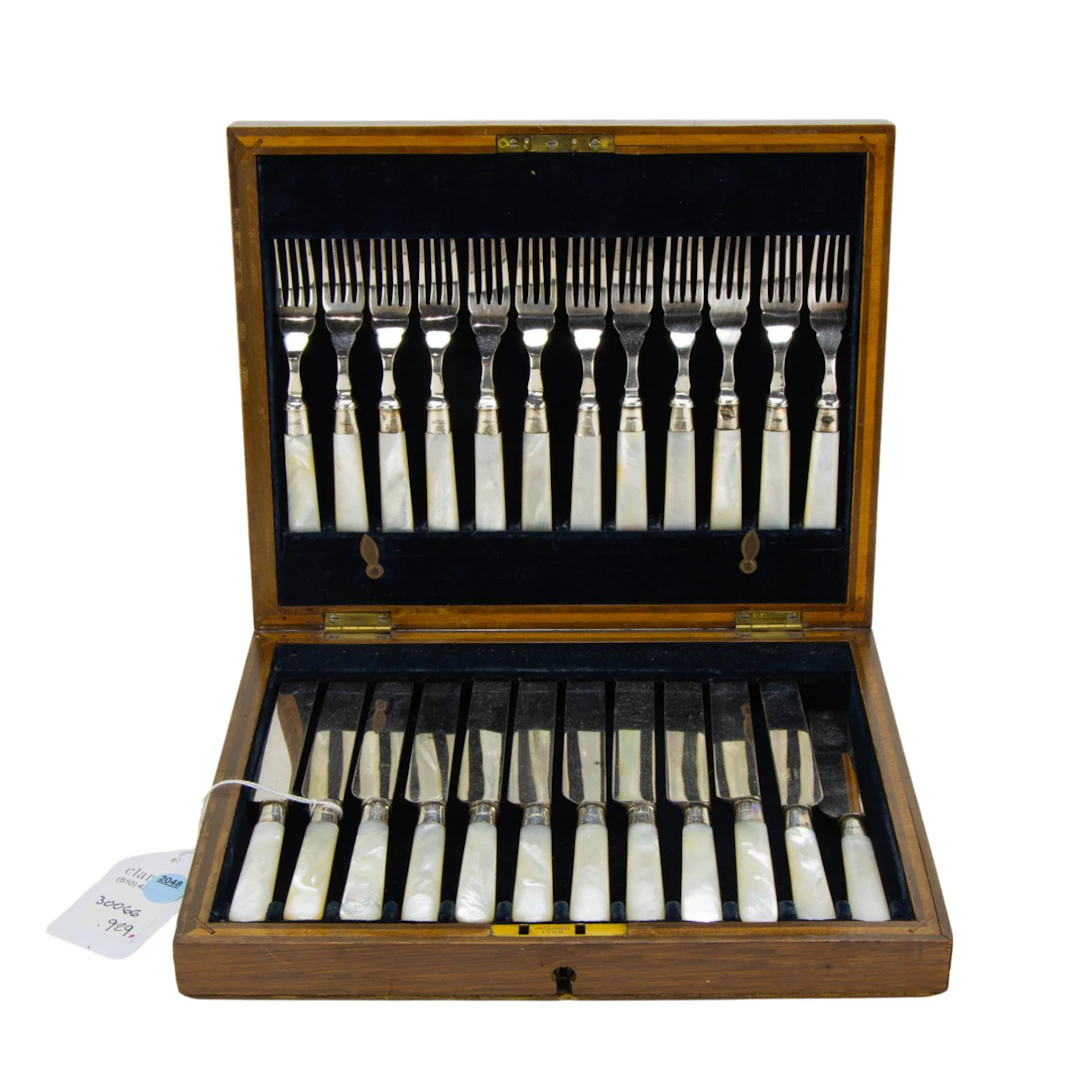 An English boxed dessert flatware set with mother of pearl handles
