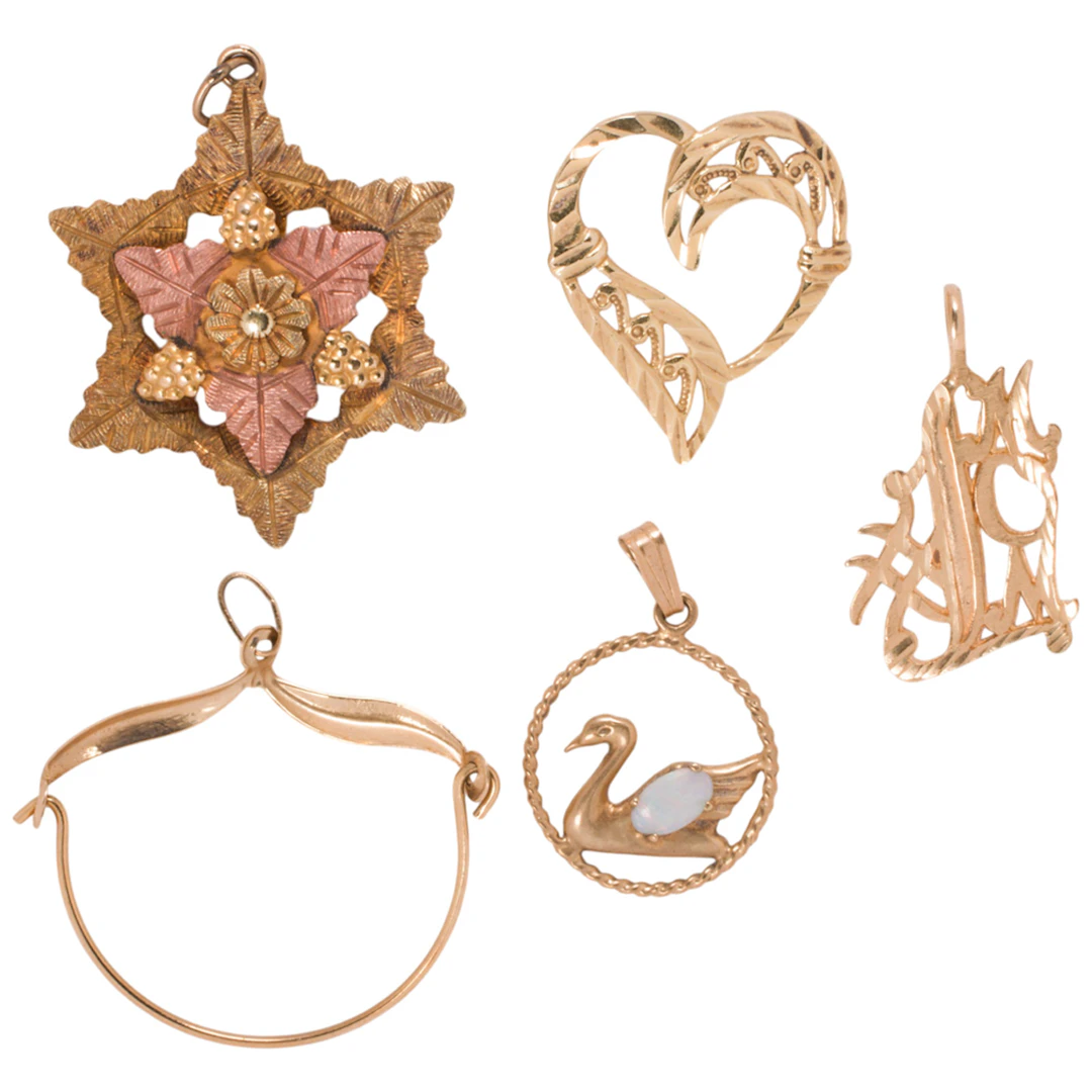 A group of gold pendants