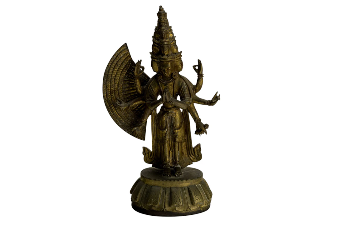 A Sino-Tibetan gilt bronze figure of the thousand-armed avalokiteshvara