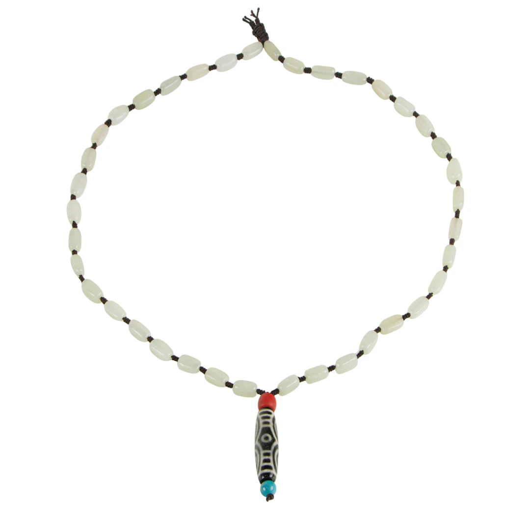 A Chinese white jade necklace with dzi bead