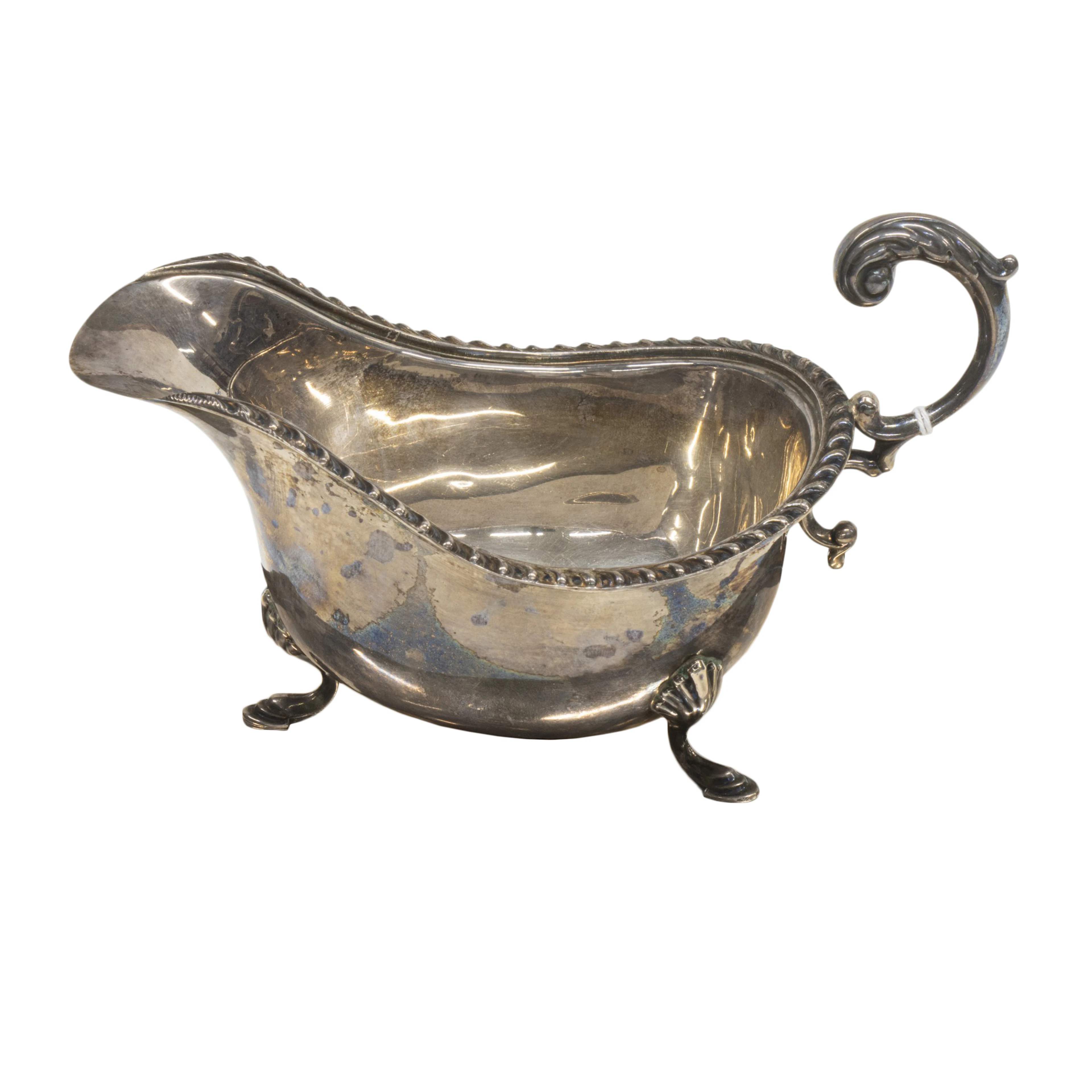 A Canadian sterling tripod sauce boat