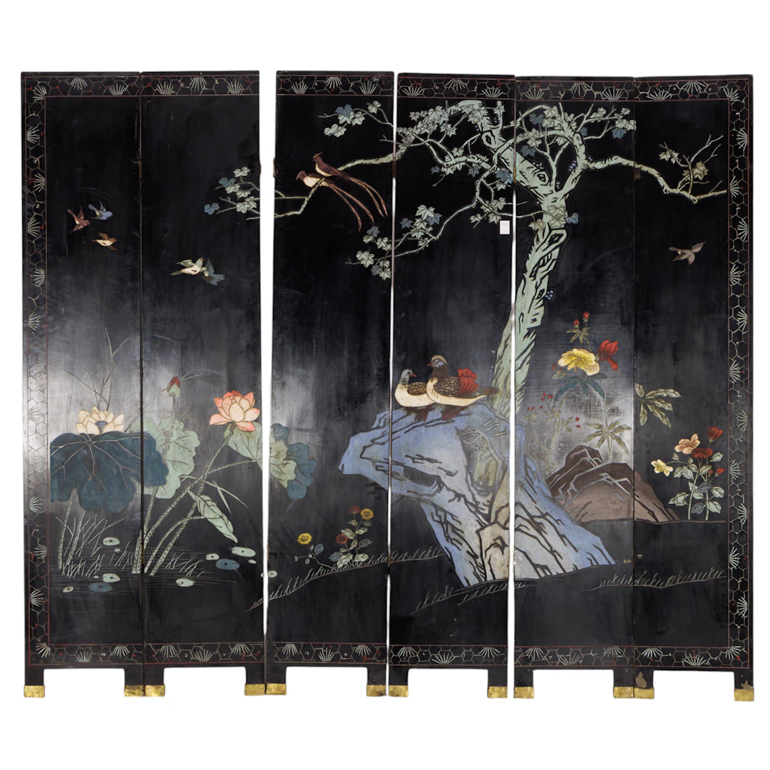 A Chinese six-panel black lacquer coromandel style folding screen